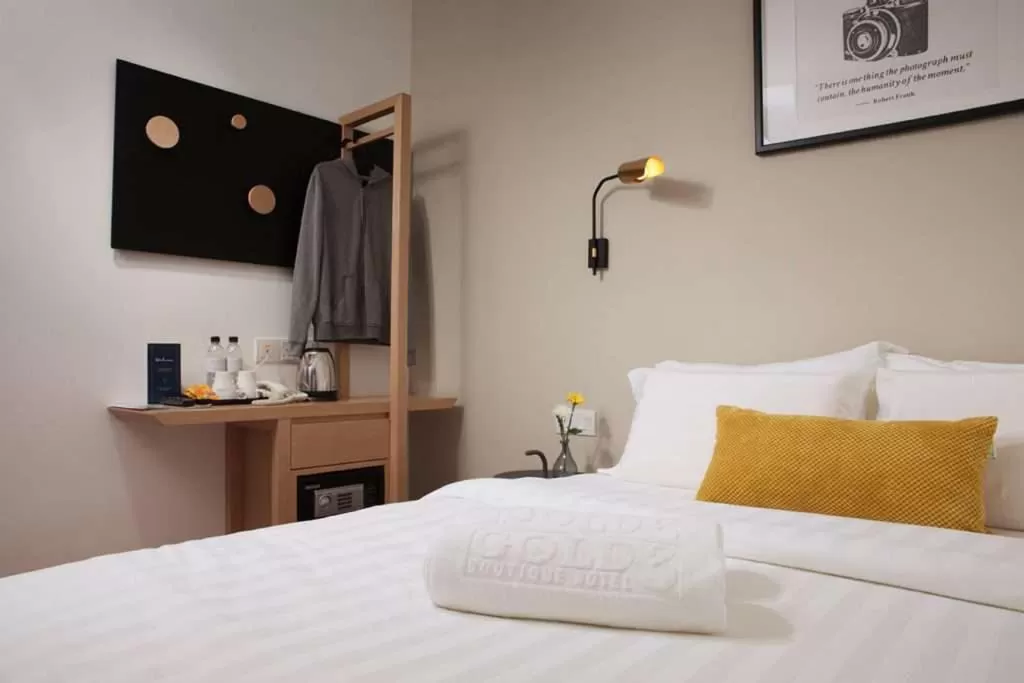 Bed in Riverfront Boutique Hotel