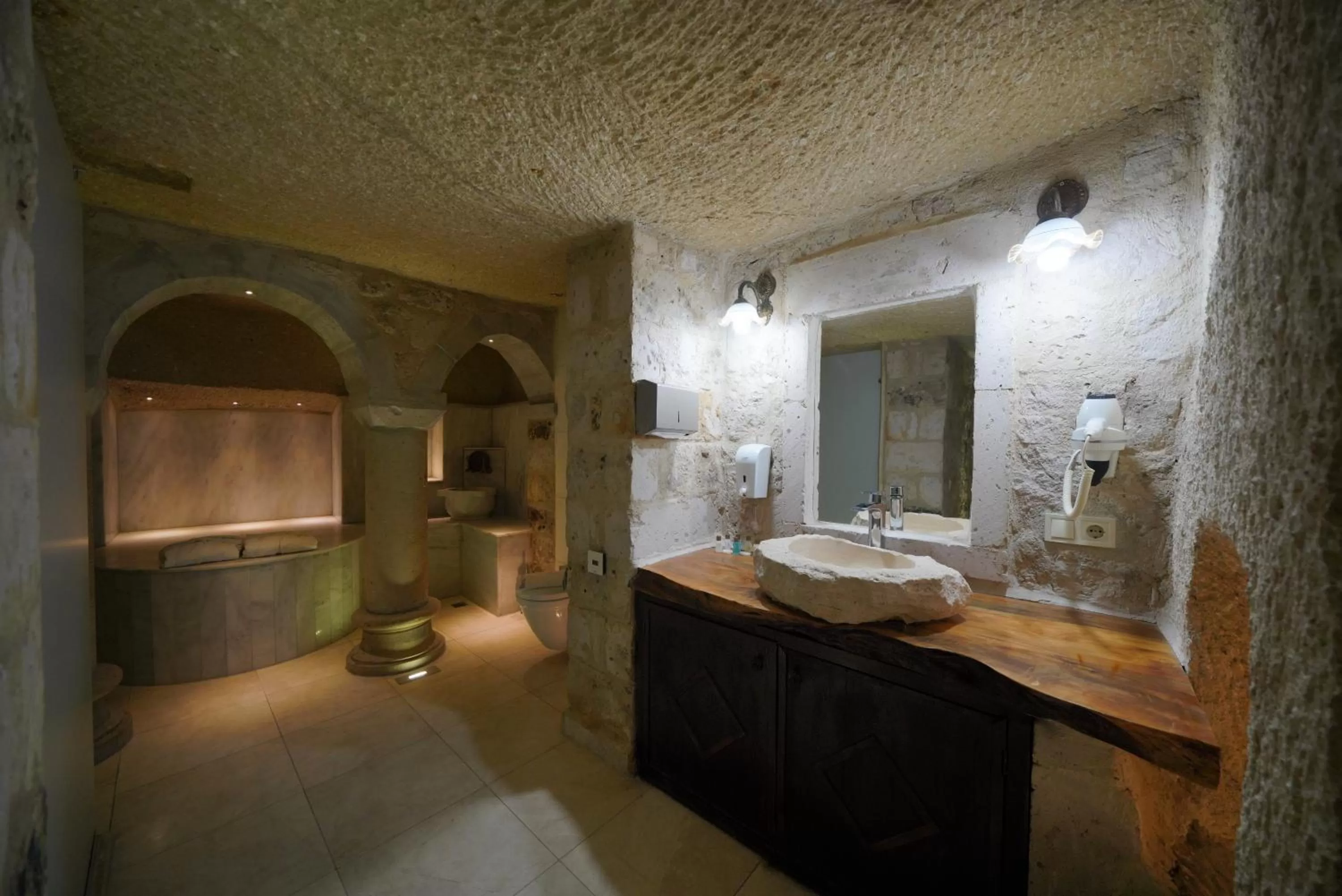 Public Bath in Shoestring Cave House