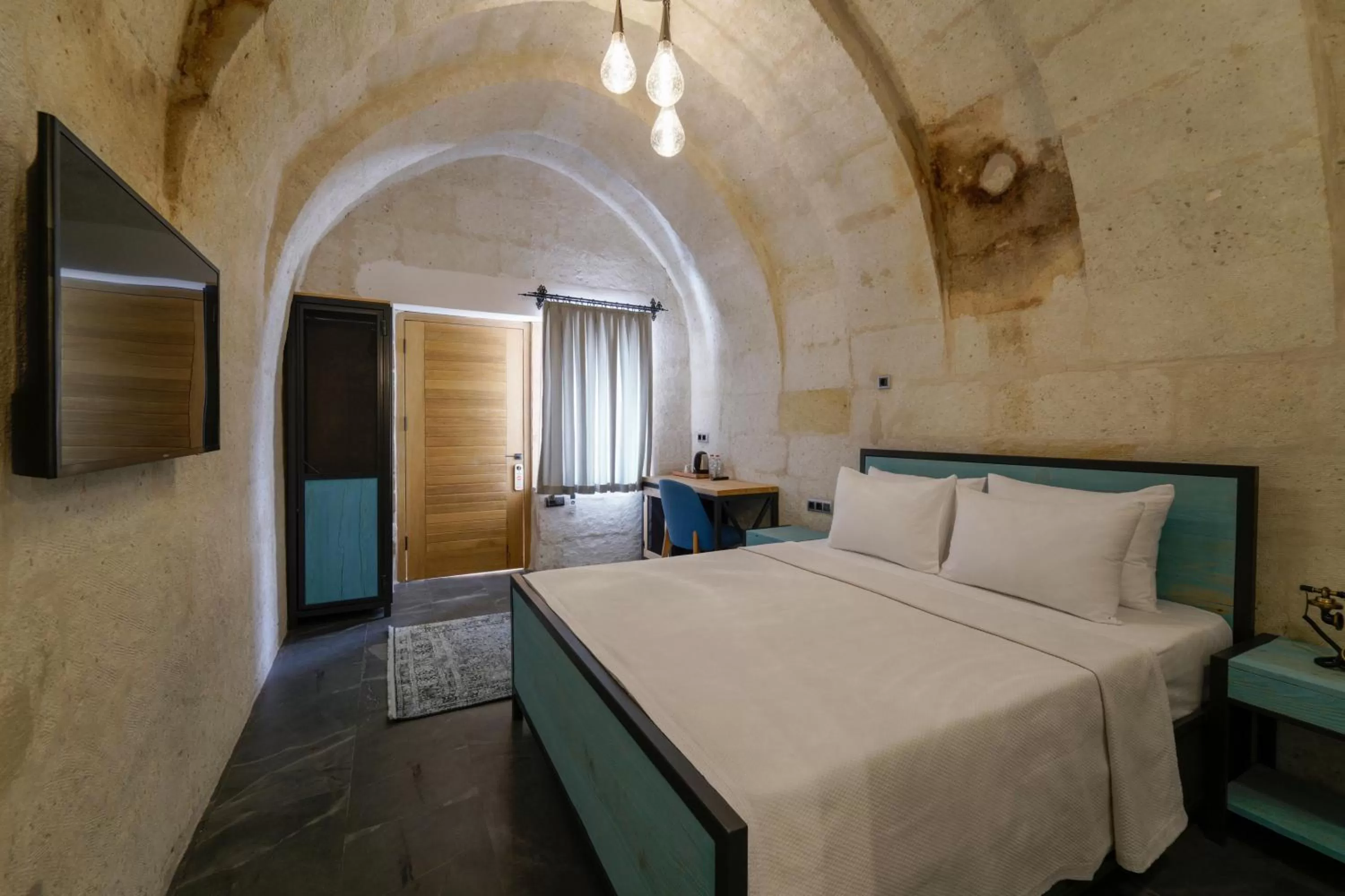 Bed in The Niche Cave Hotel