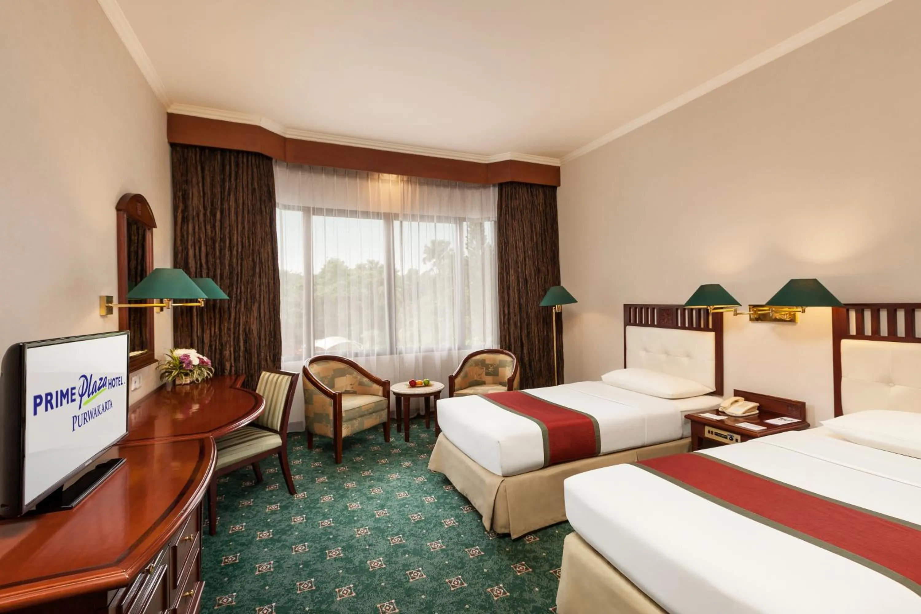 Communal lounge/ TV room, Bed in Prime Plaza Hotel Purwakarta