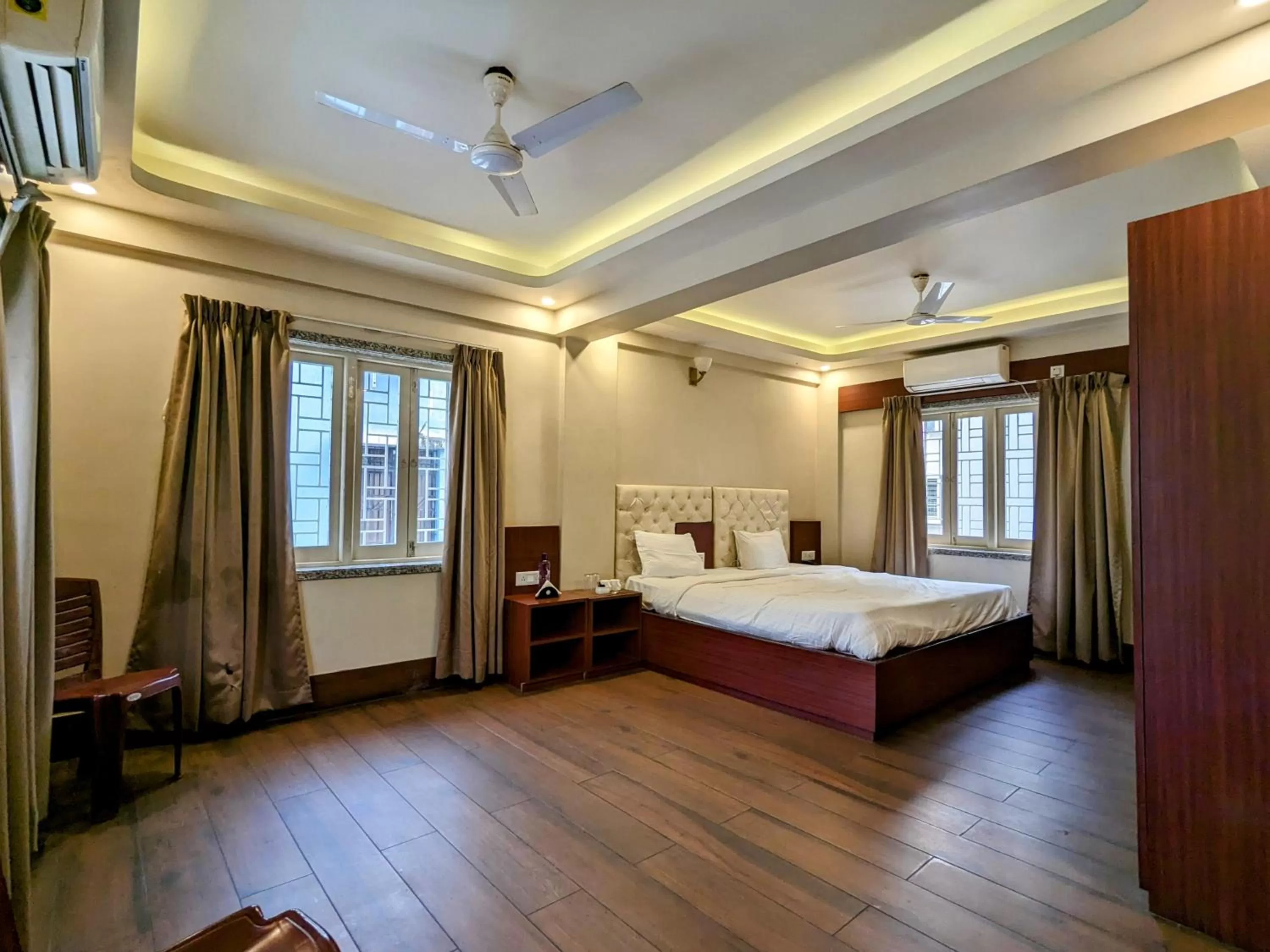 Bed in The Aster Enclave Hotel