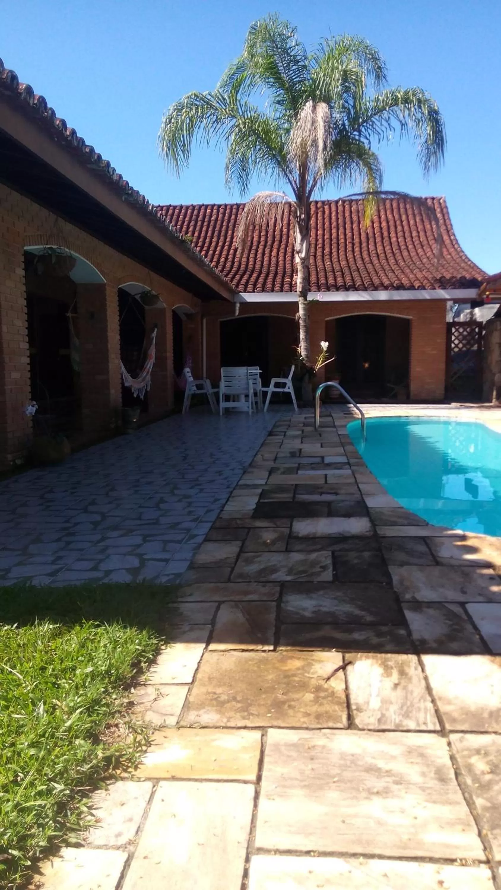 Swimming pool in Pousada Na Praia Ubatuba