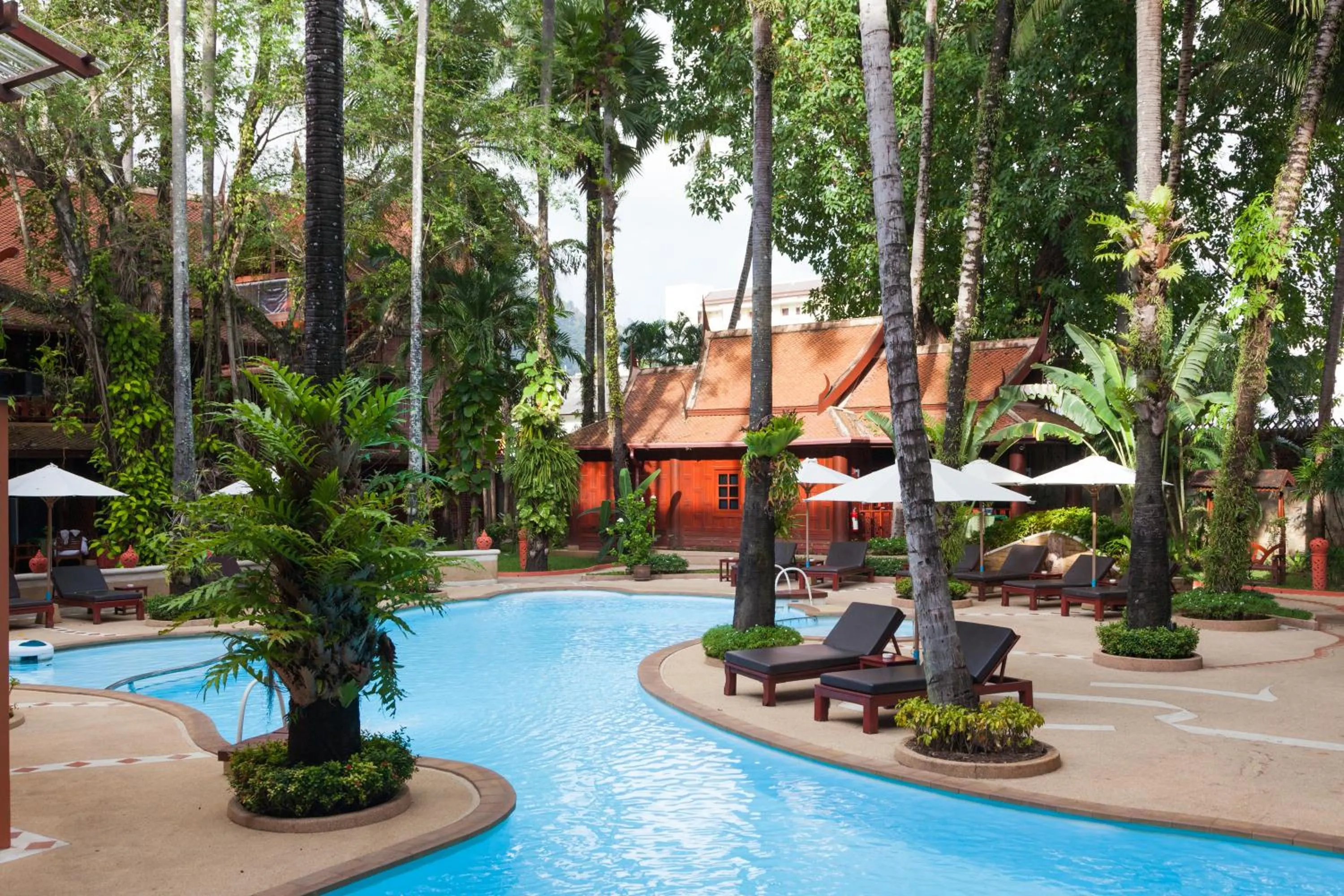 Swimming pool in Royal Phawadee Village Patong - 2 Minutes walk to the beach