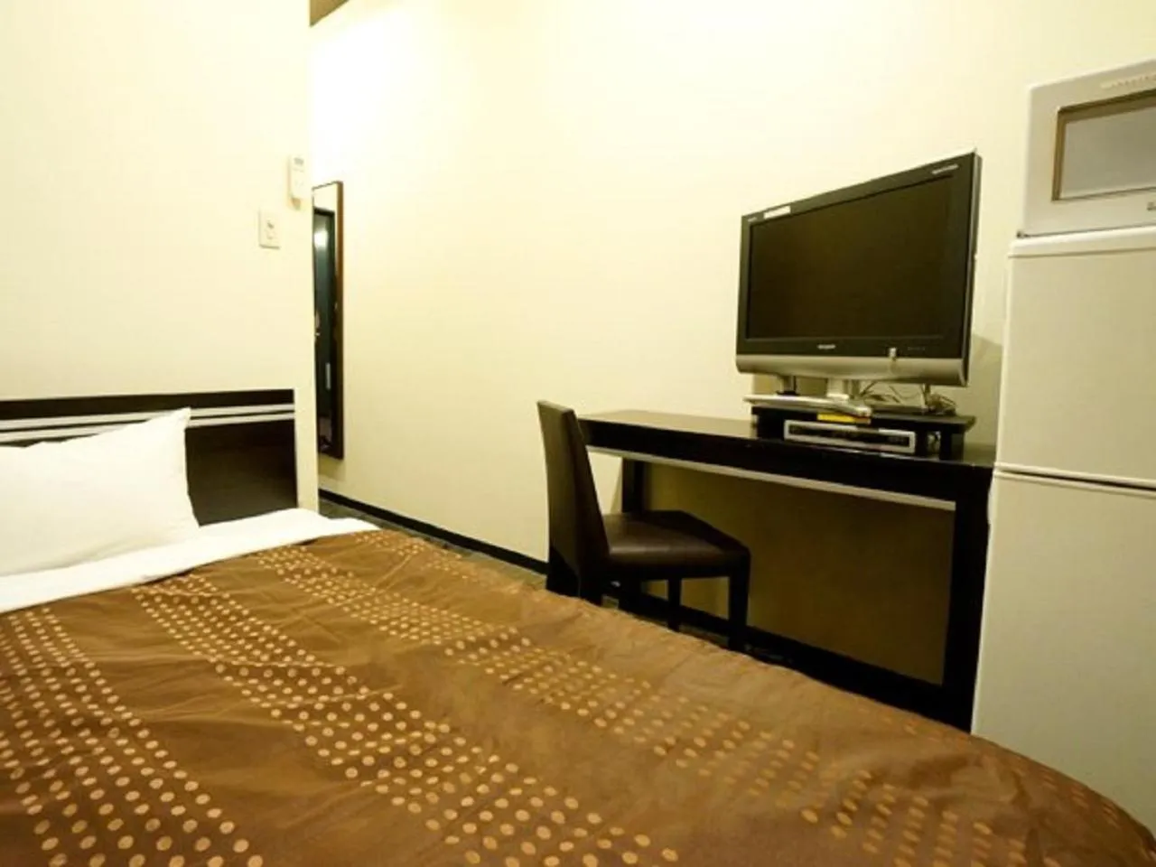 Bed in HOTEL LiVEMAX BUDGET Esaka
