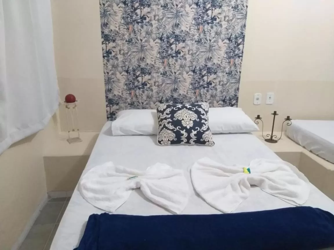 Bed in Pousada Dois Rios
