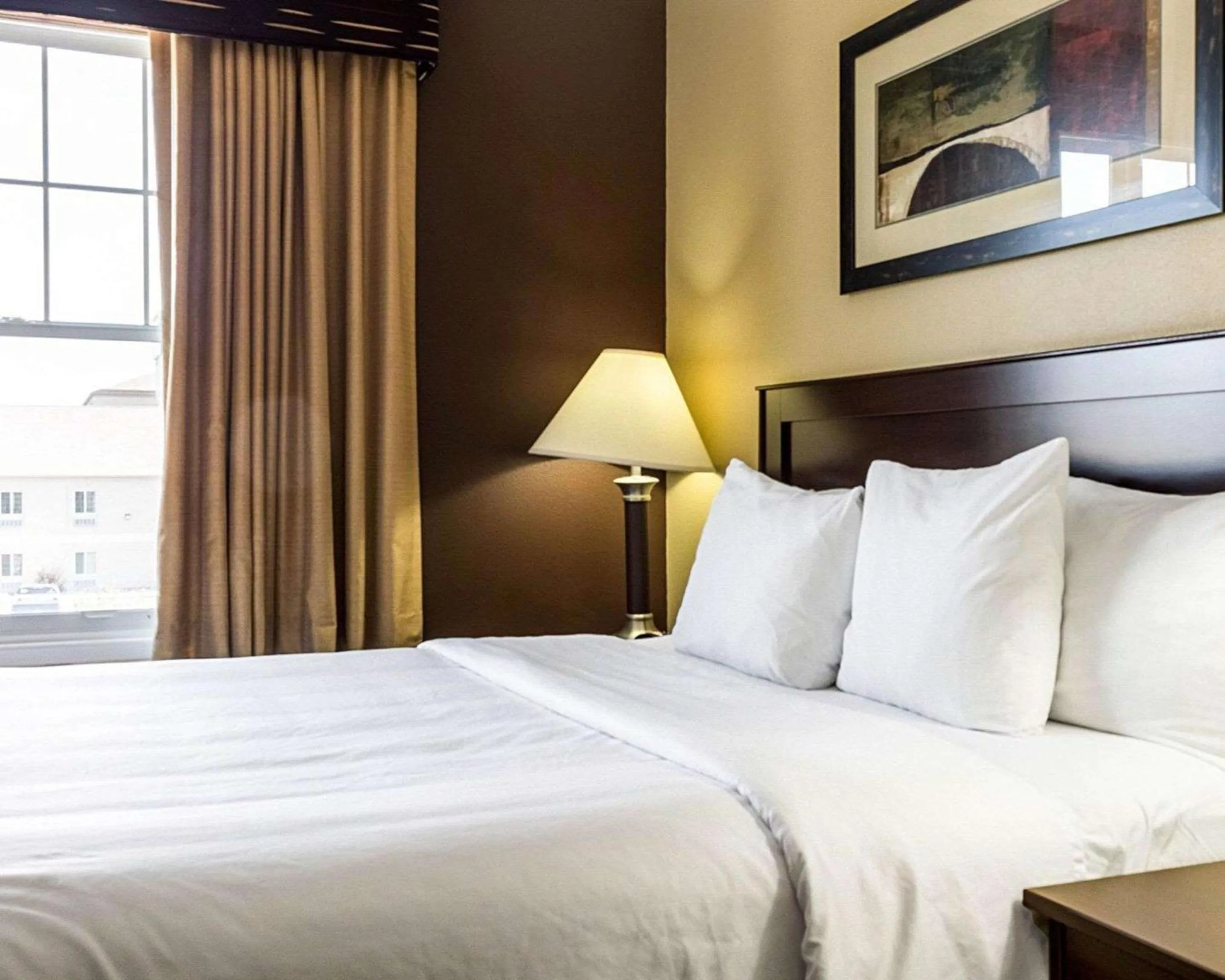 Bed in MainStay Suites Minot