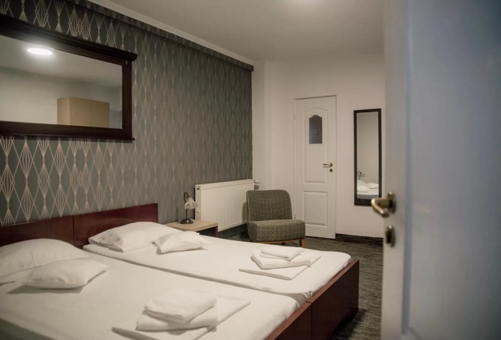 Bed in Carnival City Hotel Oradea