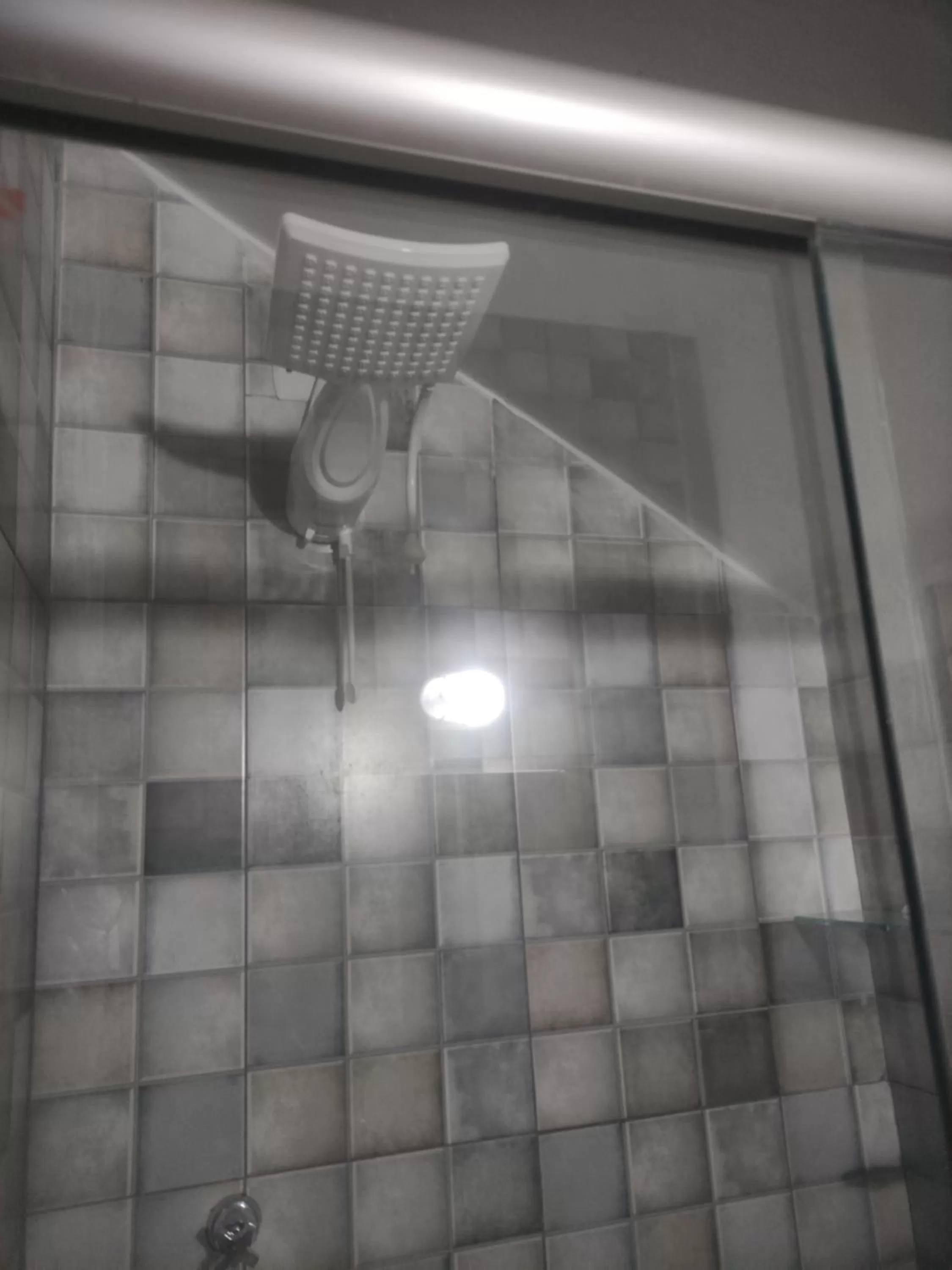 Bathroom in Pousada da Gi Suítes e Turismo