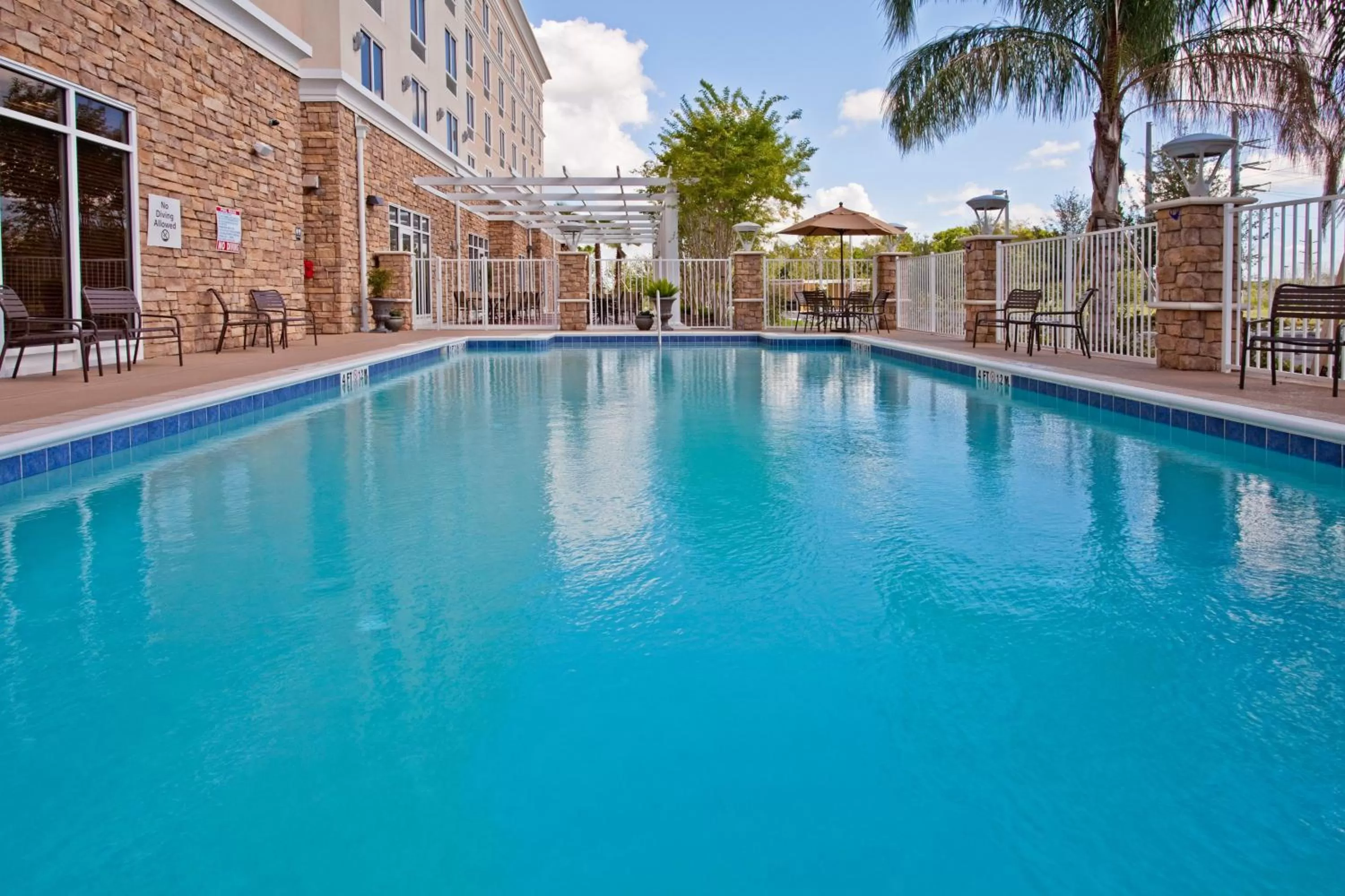 Swimming pool in Holiday Inn Titusville/Kennedy Space Center by IHG