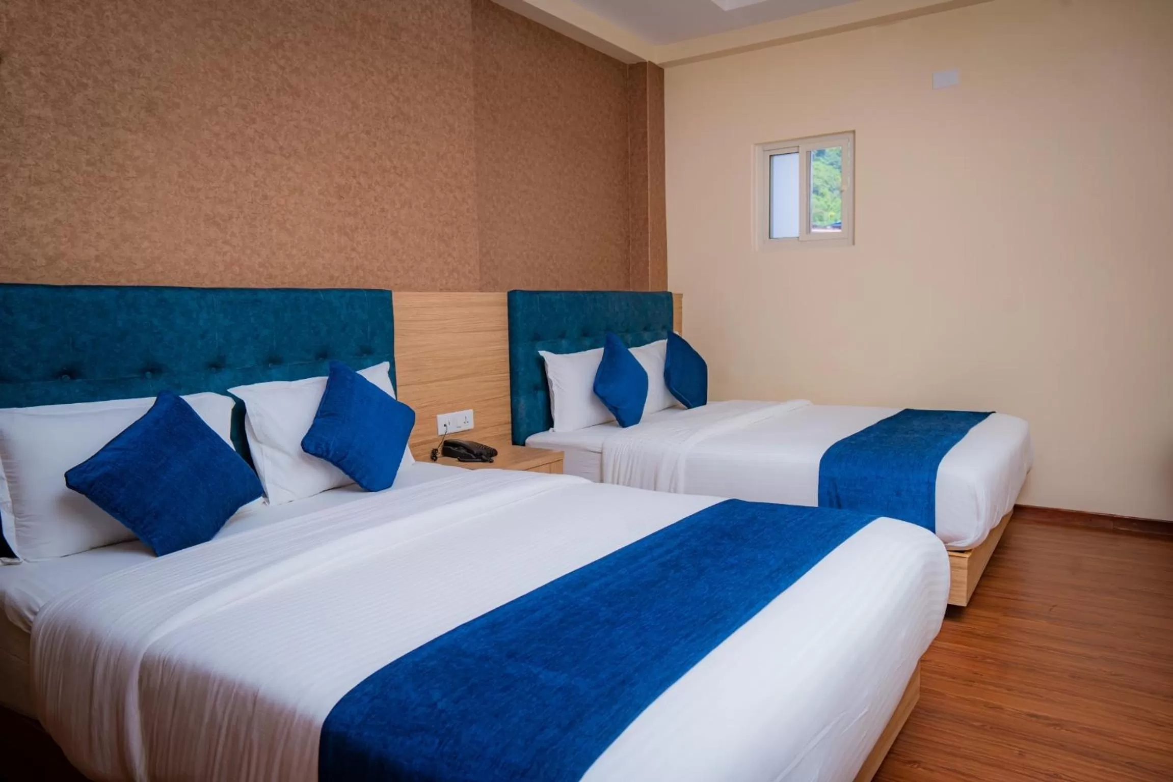 Bed in Majestic Lake Front Hotel & Suites