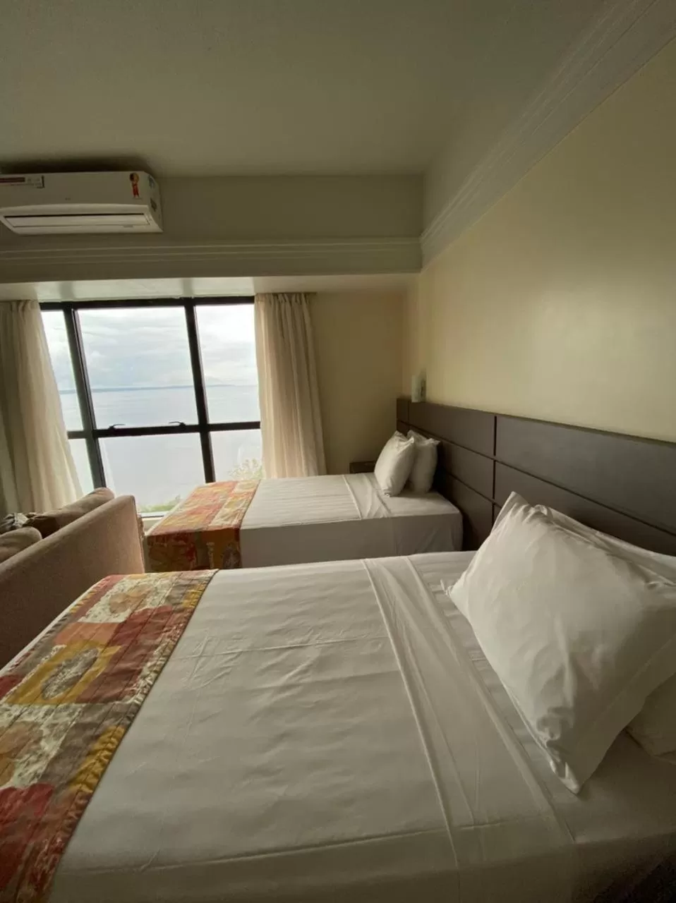 Bed in Tropical Executive Hotel