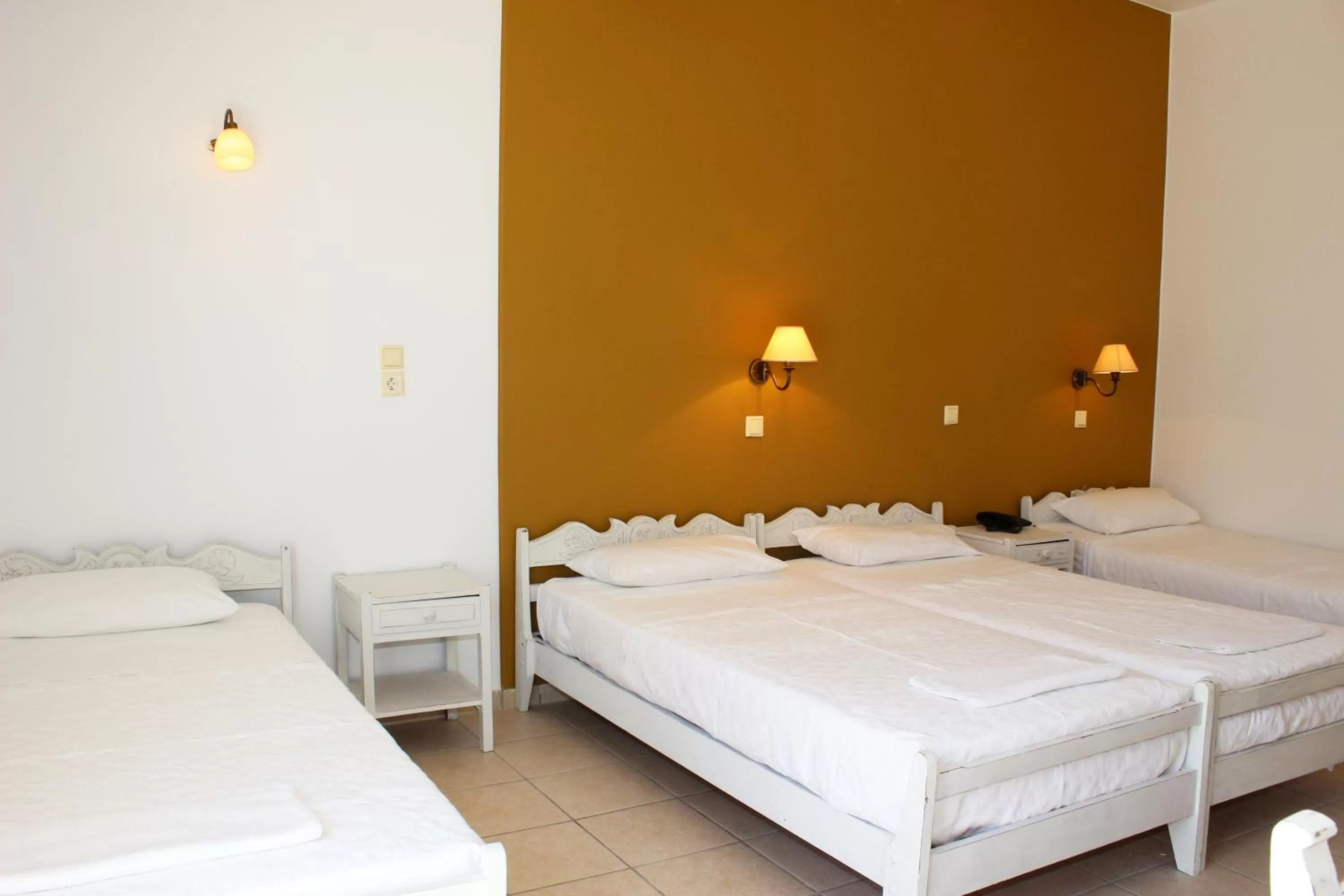 Bed in Ikaros Art Hotel