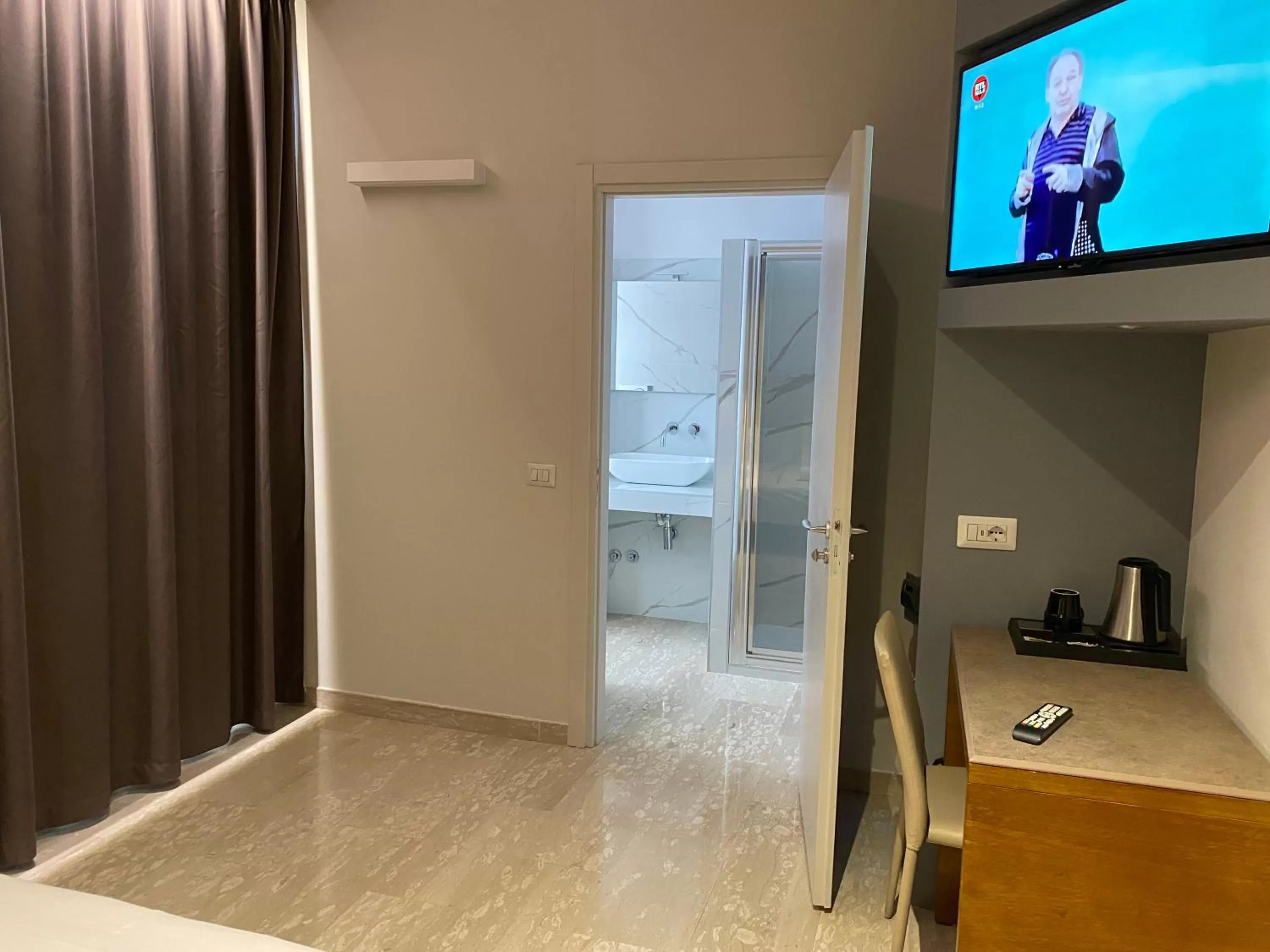 Bedroom in Oasi Village Hotel