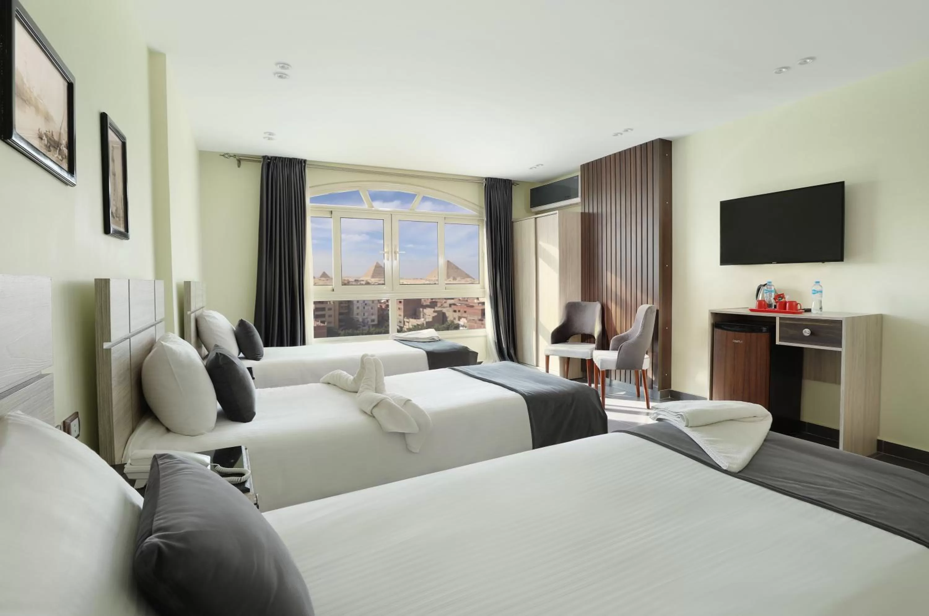 Communal lounge/ TV room in Brothers Pyramids View Hotel