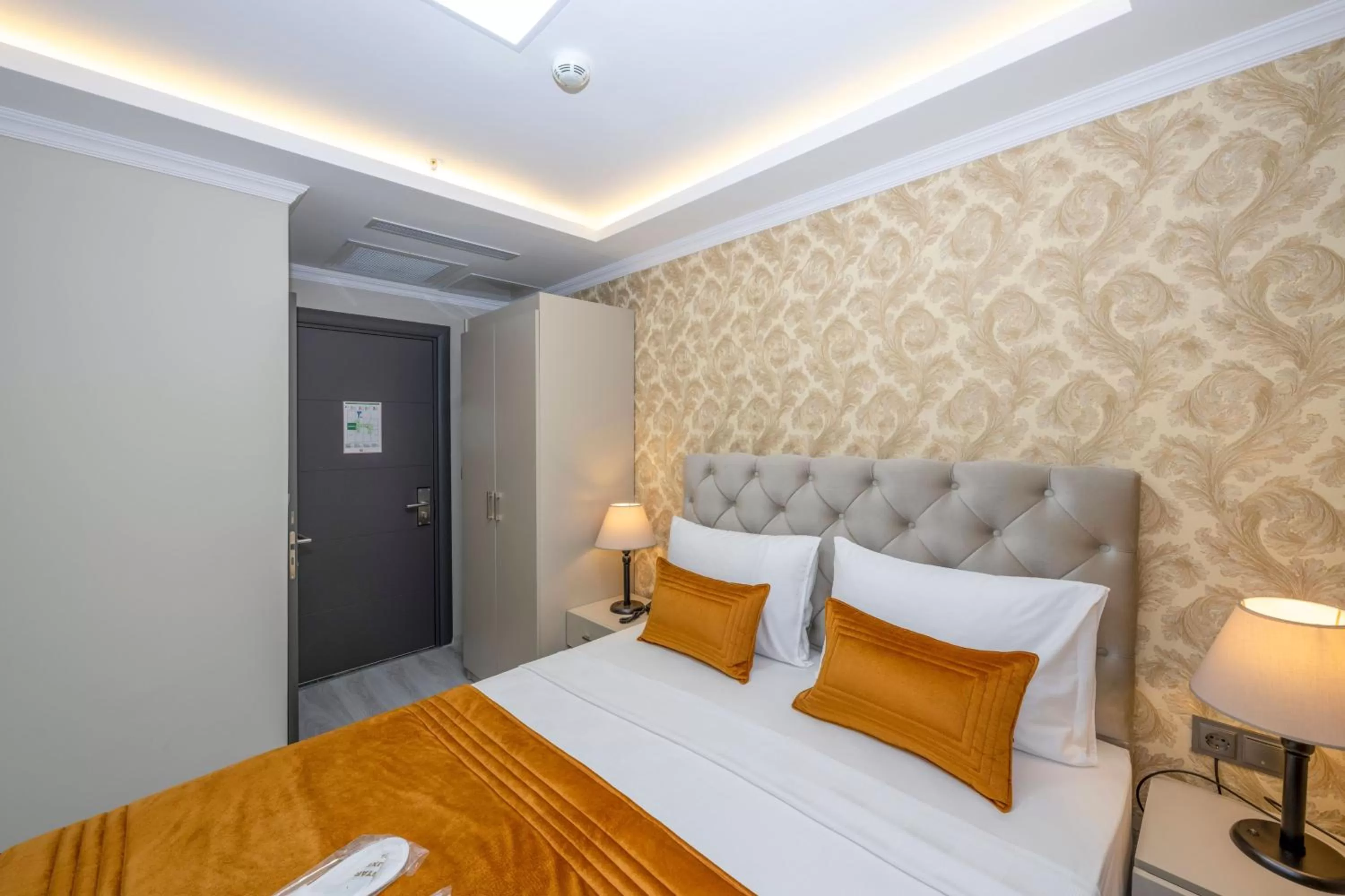 Bed in SKYSTAR DELUXE HOTEL