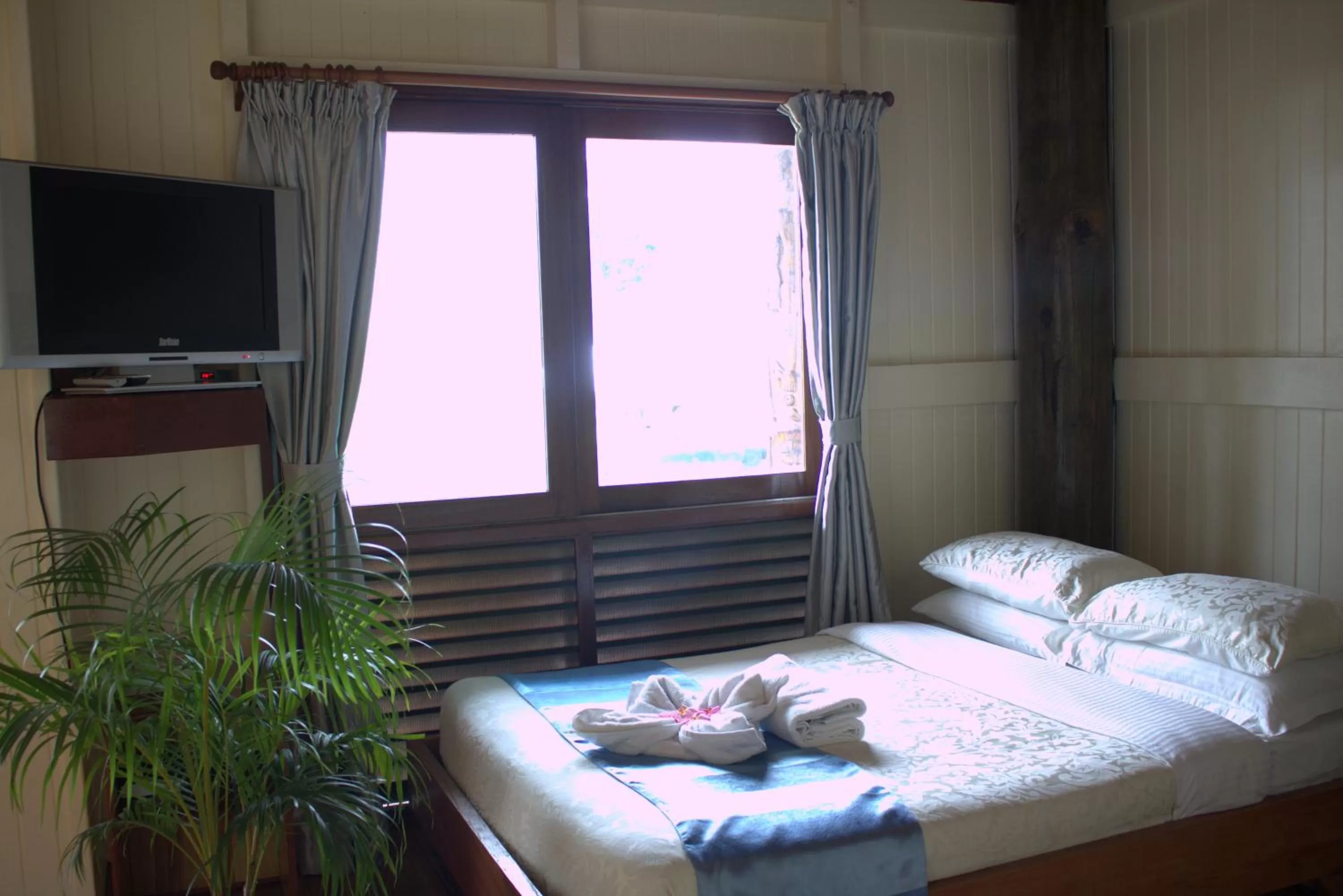 Bed in Rapopo Plantation Resort