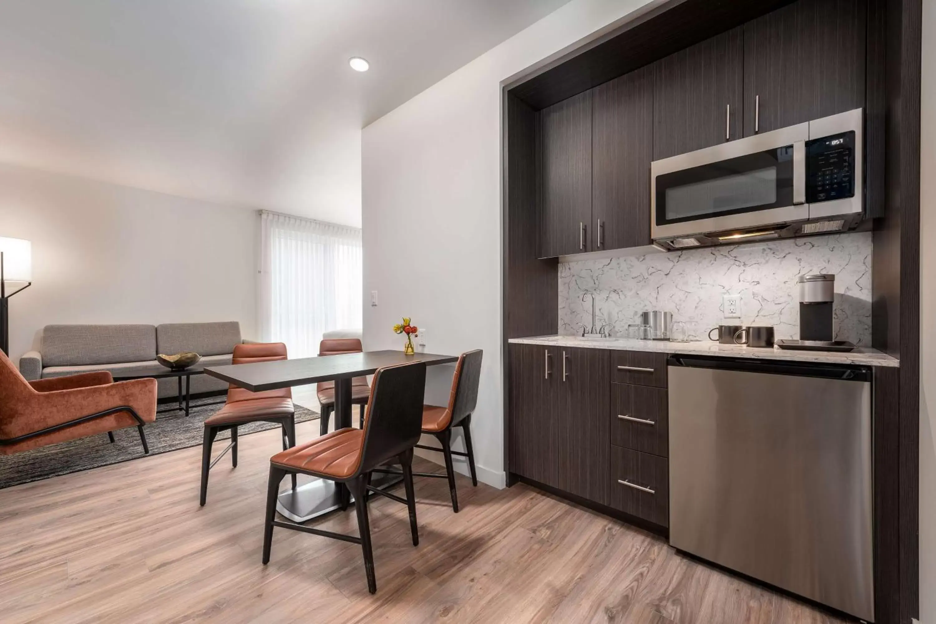 Deluxe Queen Room with Two Queen Beds and Sitting Area in Holman Riverfront Park Hotel Salem, Tapestry By Hilton Deluxe Queen Room with Two Queen Beds and Sitting Area in Holman Riverfront Park Hotel Salem, Tapestry By Hilton