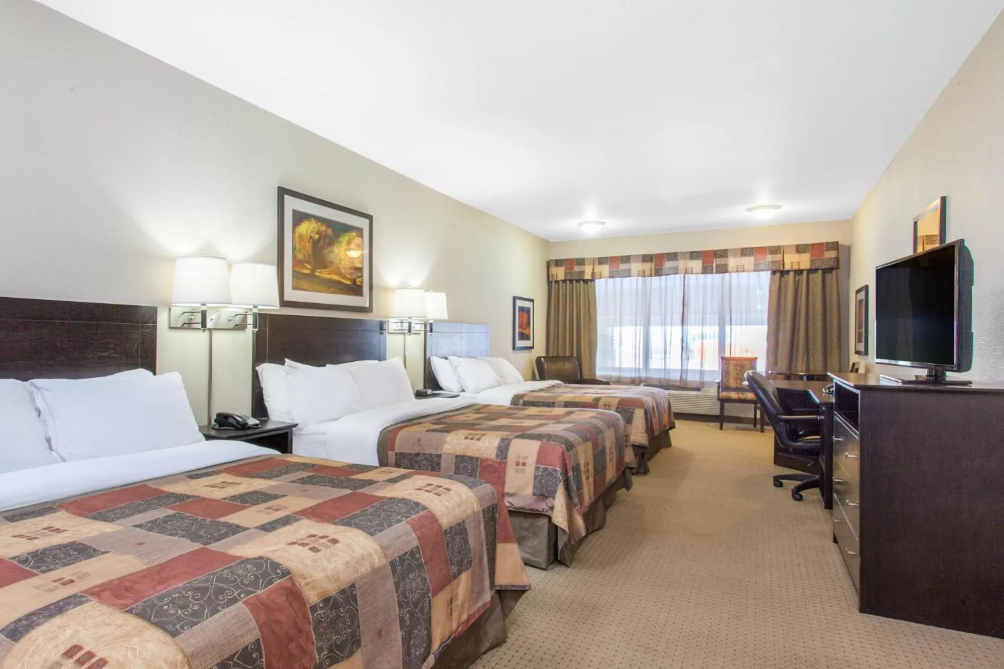 Bed in Ramada by Wyndham Pincher Creek