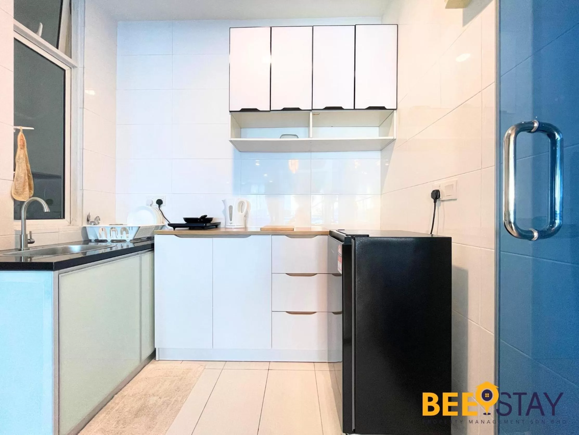 Kitchen/Kitchenette in The Wave Suites Melaka by BEESTAY