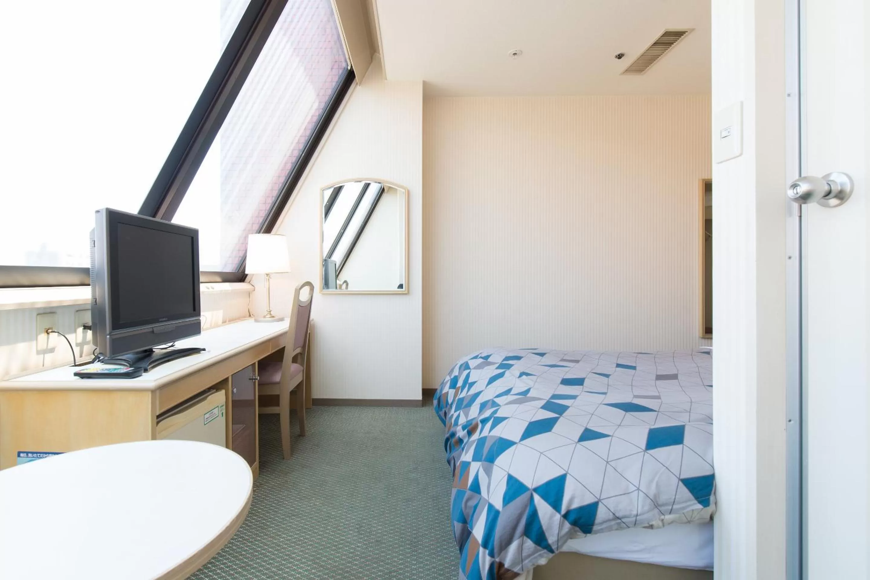 Photo of the whole room, Bed in Tabist Hotel Tetora Kitakyushu