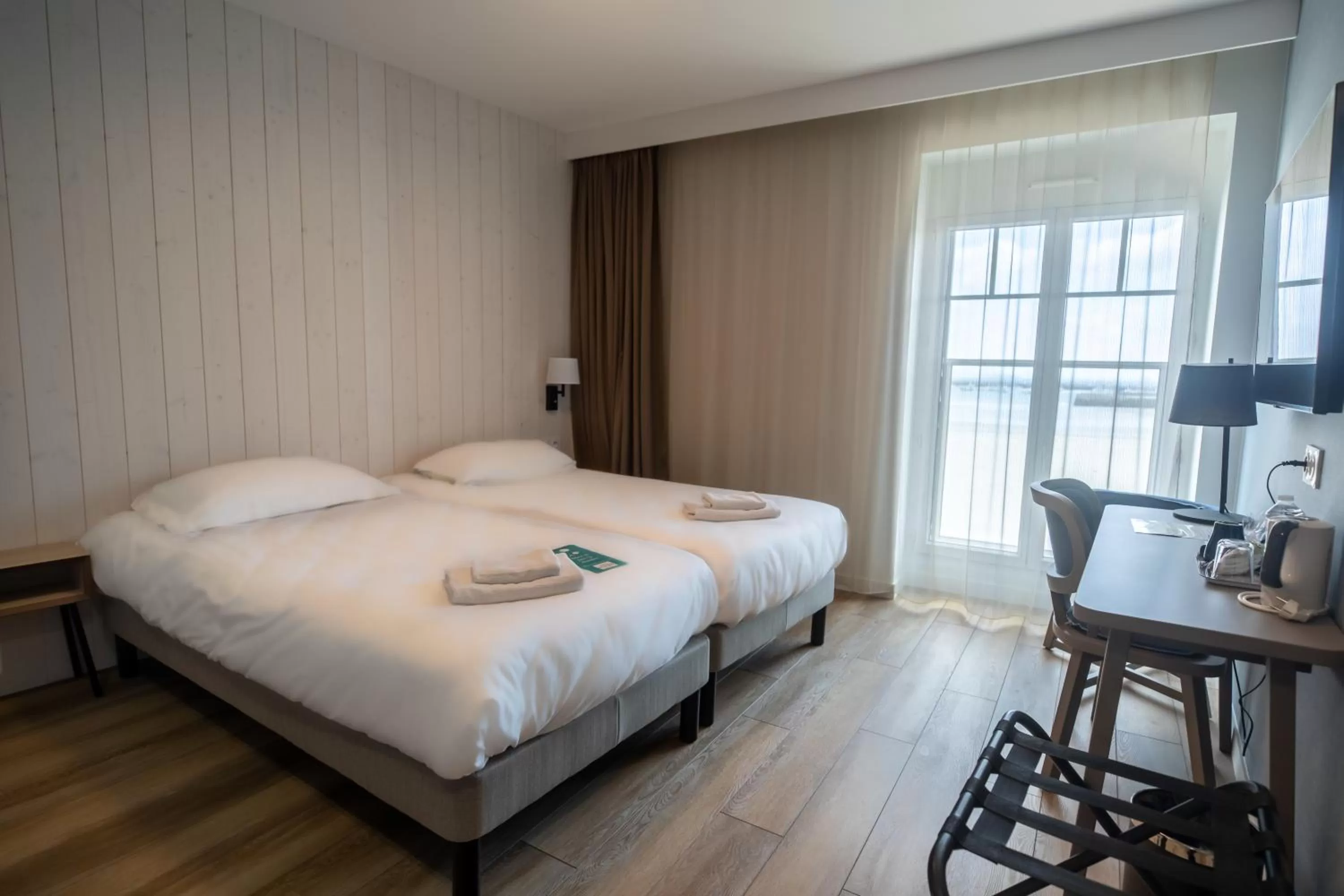 Bed in Hôtel de la Baie