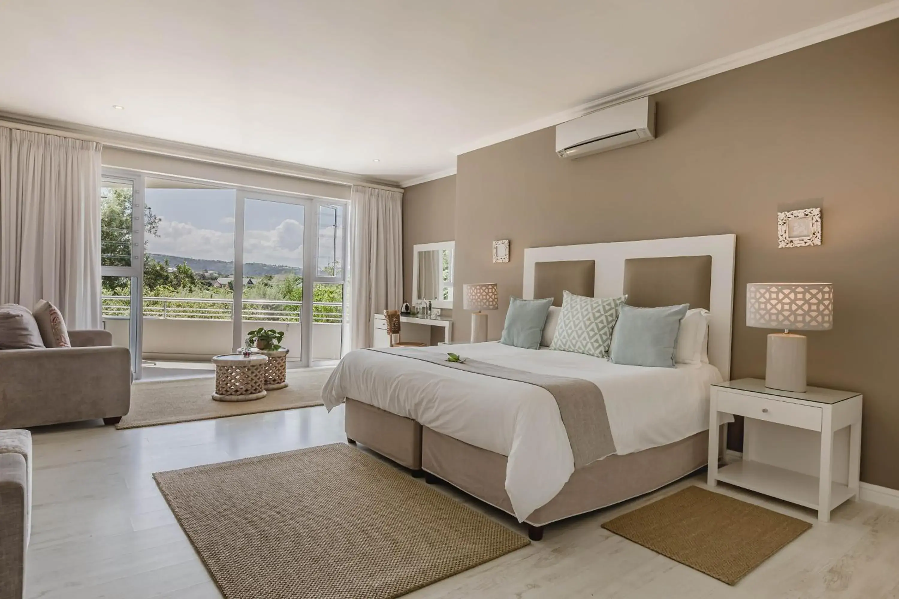 Luxury Room with Balcony in The Robberg Beach Lodge - Lion Roars Hotels & Lodges Luxury Room with Balcony in The Robberg Beach Lodge - Lion Roars Hotels & Lodges