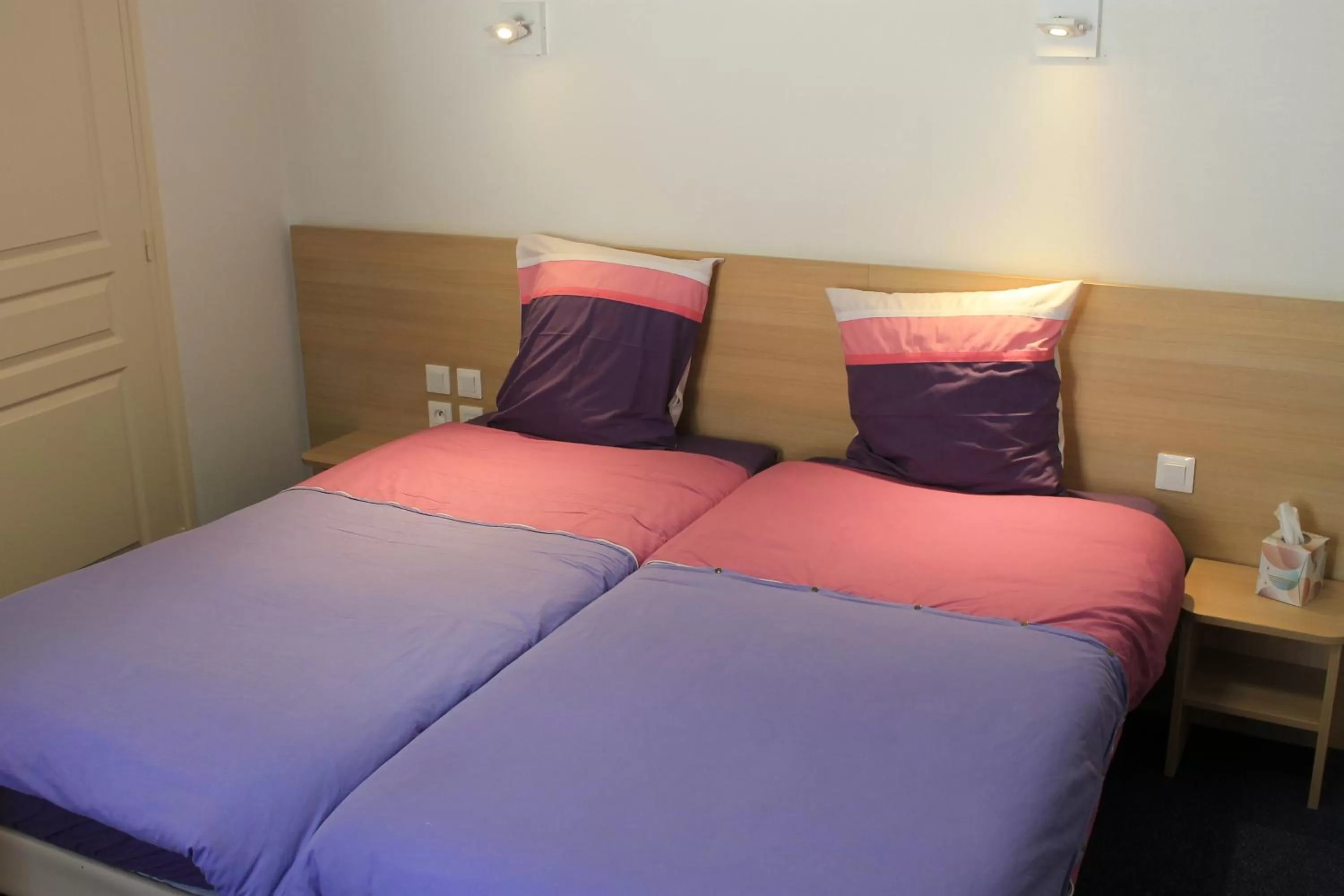 Bed in Hôtel du lion d'or