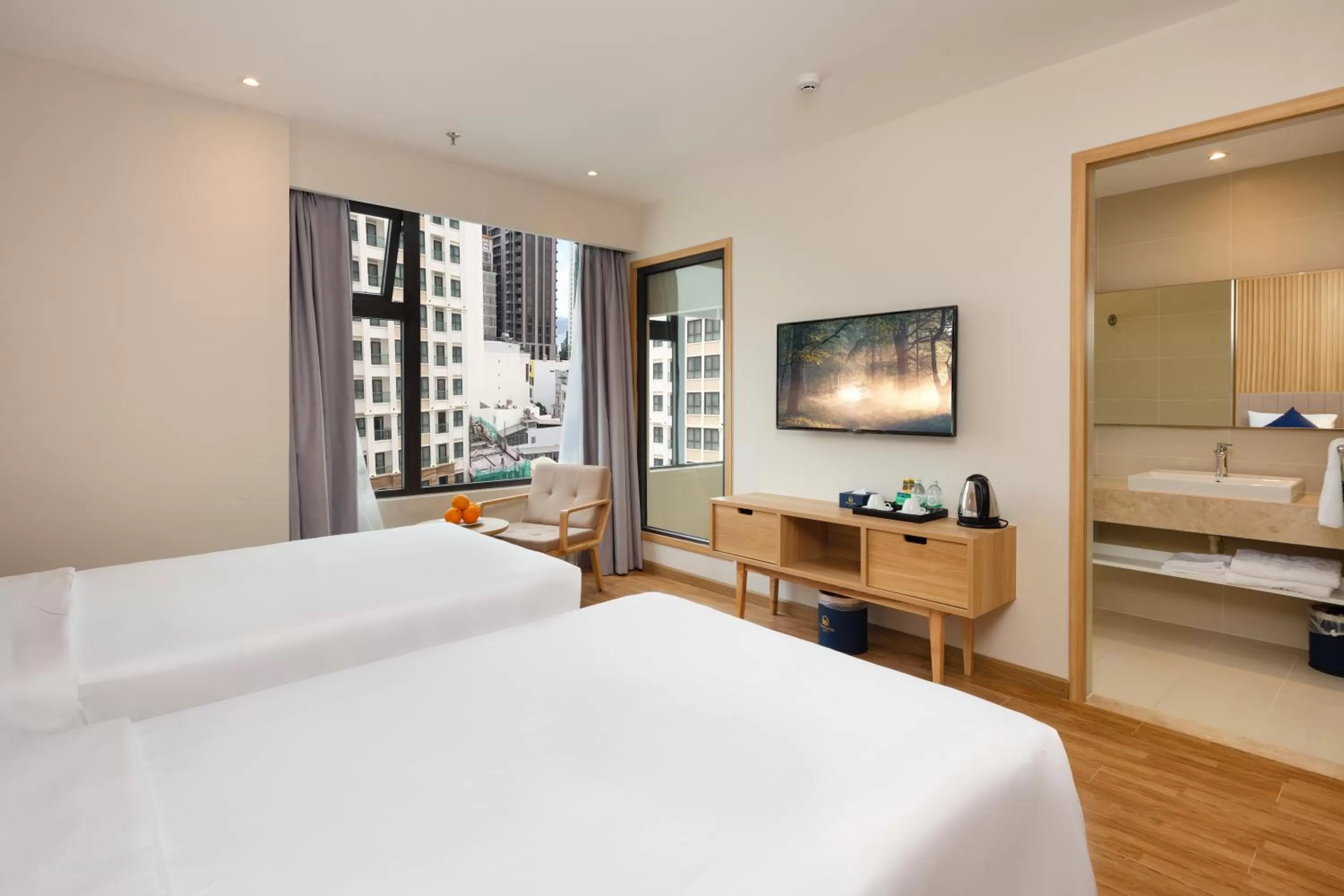 Bed in VENTANA NHA TRANG HOTEL