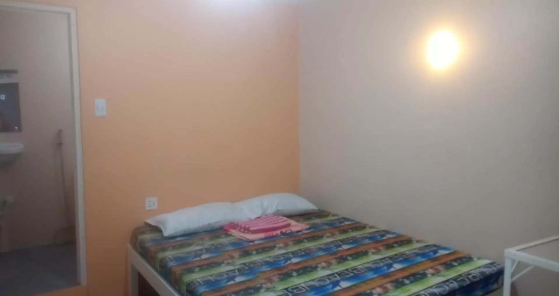 Bed in ROBIE'S TRANSIENTS ROOMS