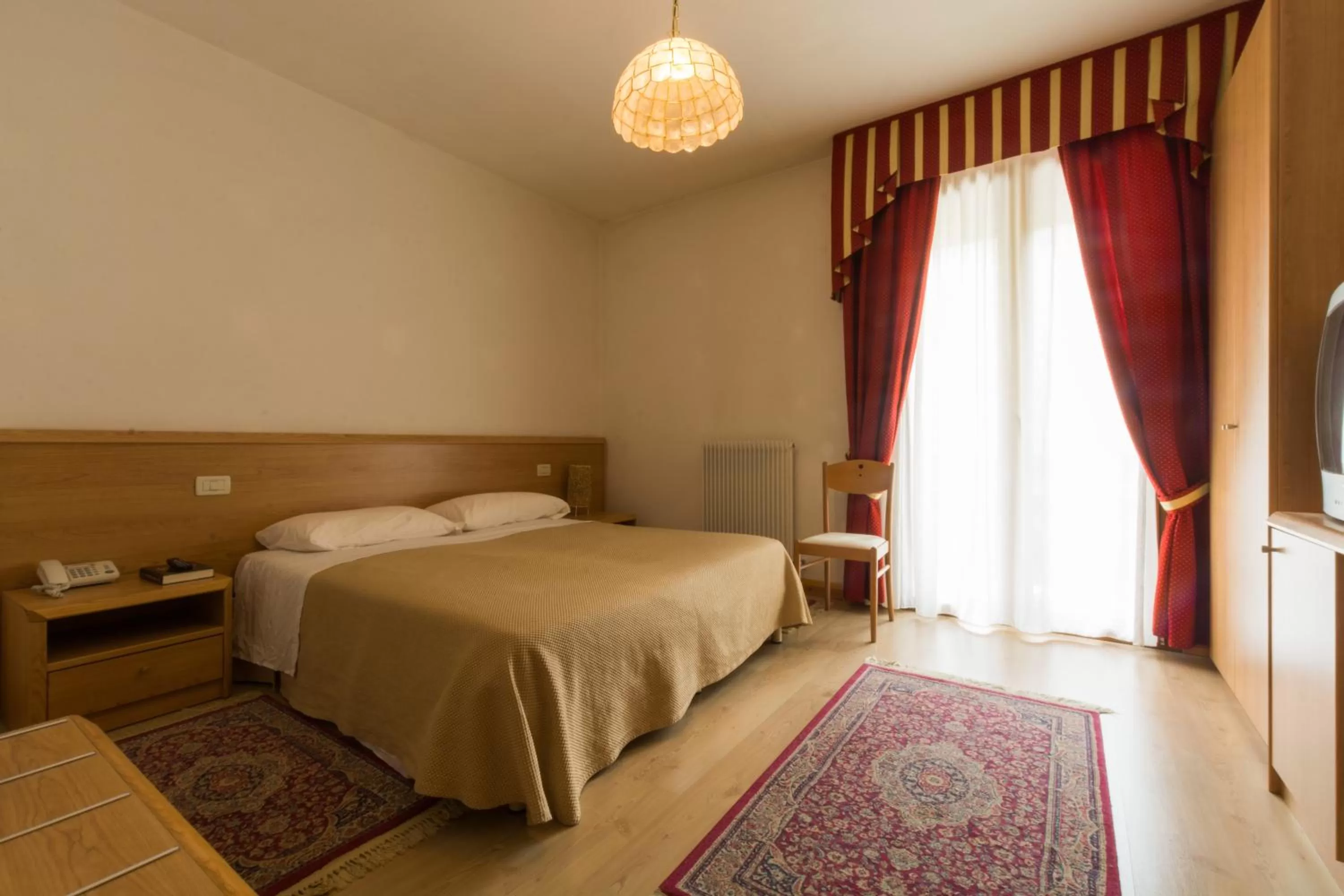 Bed in Albergo Dalla Mena