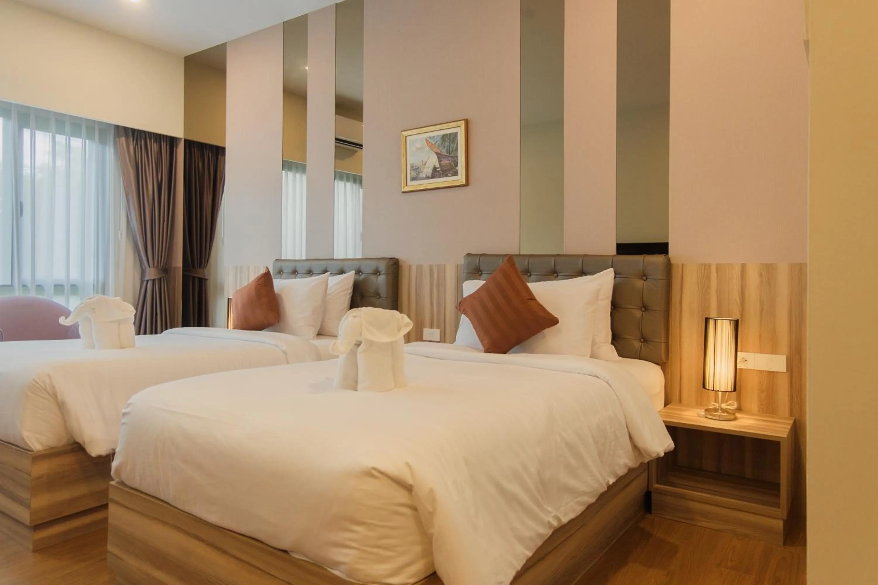 Bed in Sukruethai Hotel Chiang Mai - โรงแรมสุขฤทัย เชียงใหม่