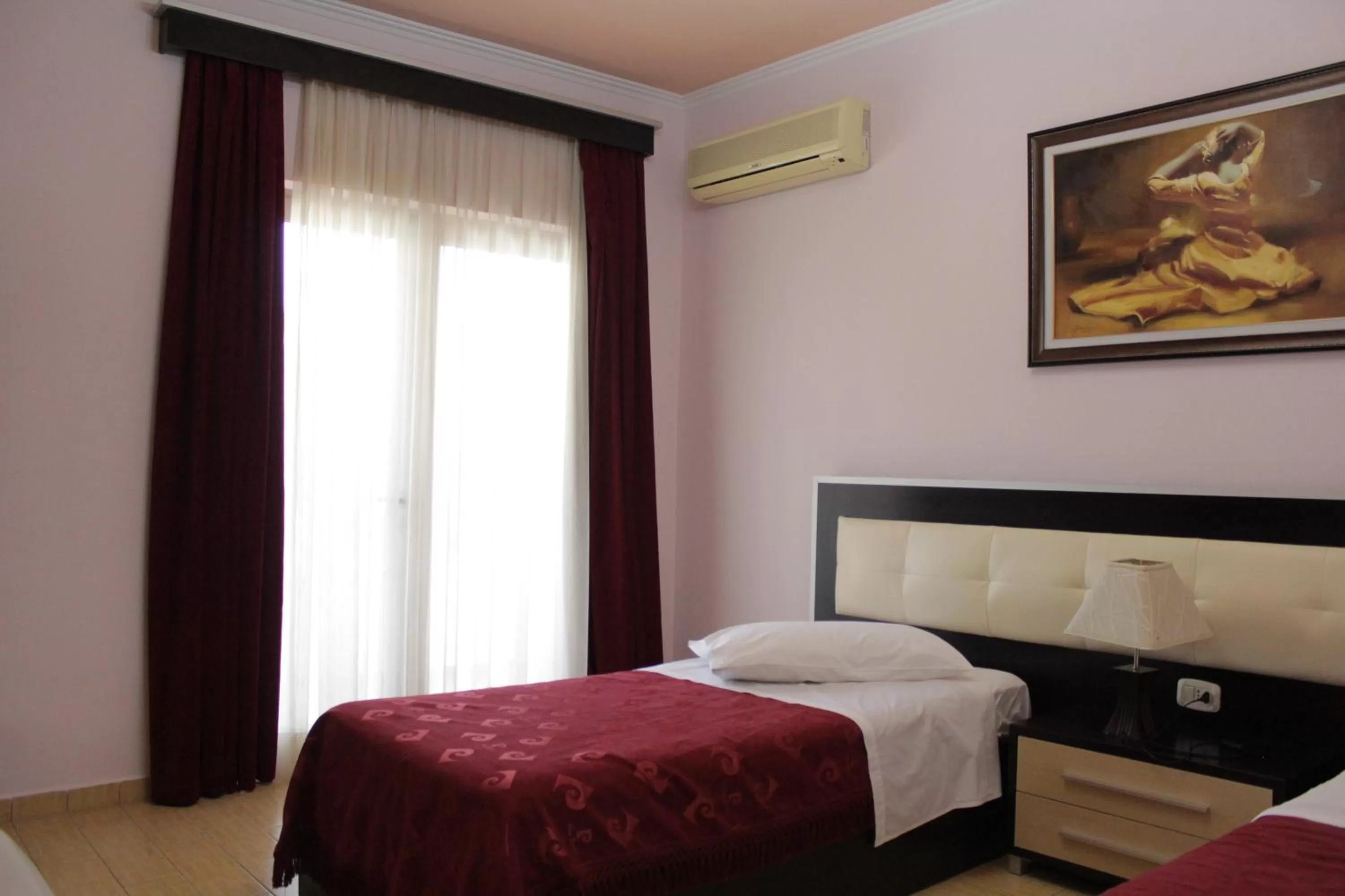 Bed in Fieri International Hotel