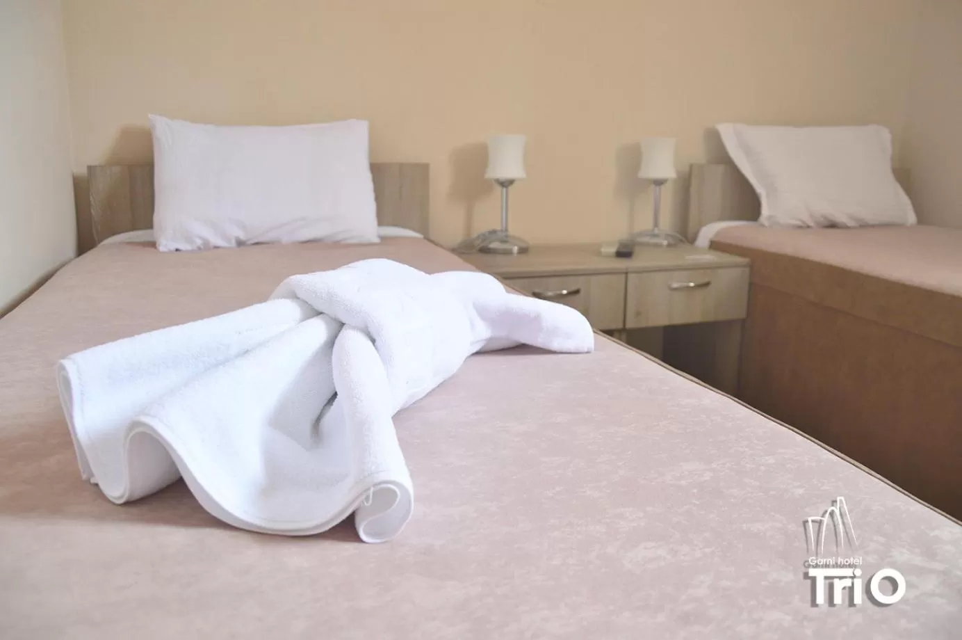 Bed in Garni Hotel Tri O