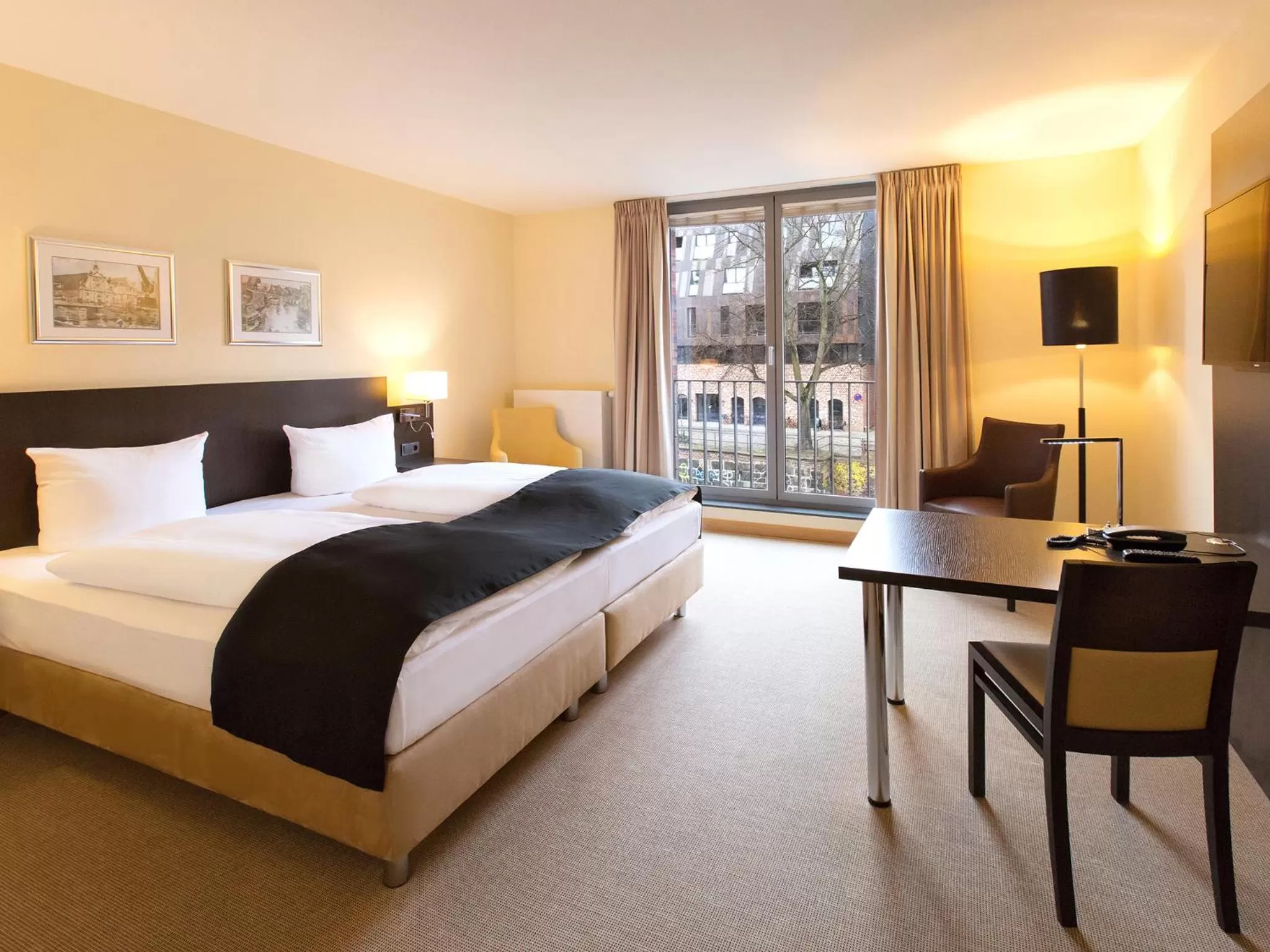 Photo of the whole room, Bed in DORMERO Hotel Altes Kaufhaus Lüneburg