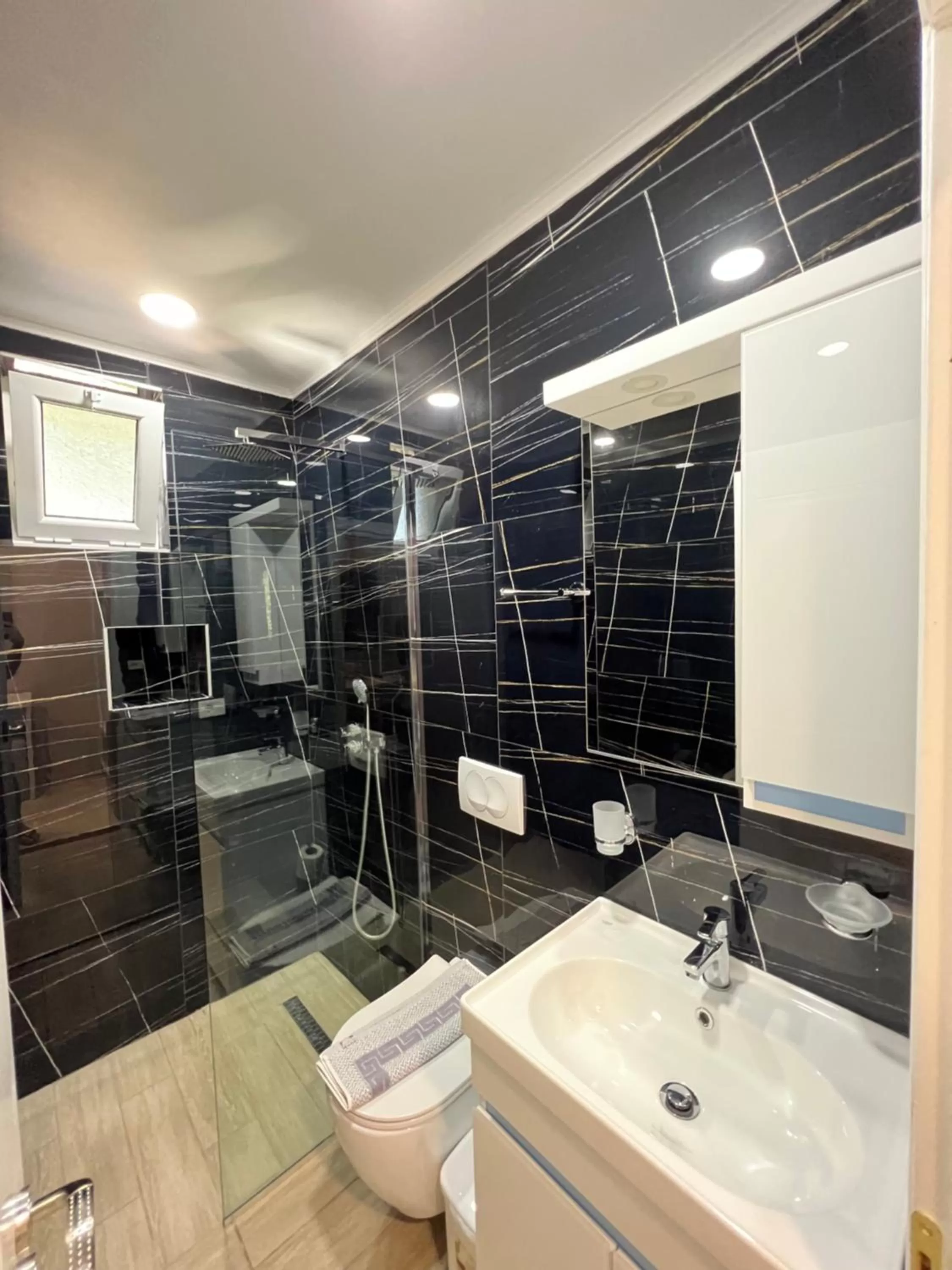 Bathroom in Aphrodite Garden Rooms & Apartment