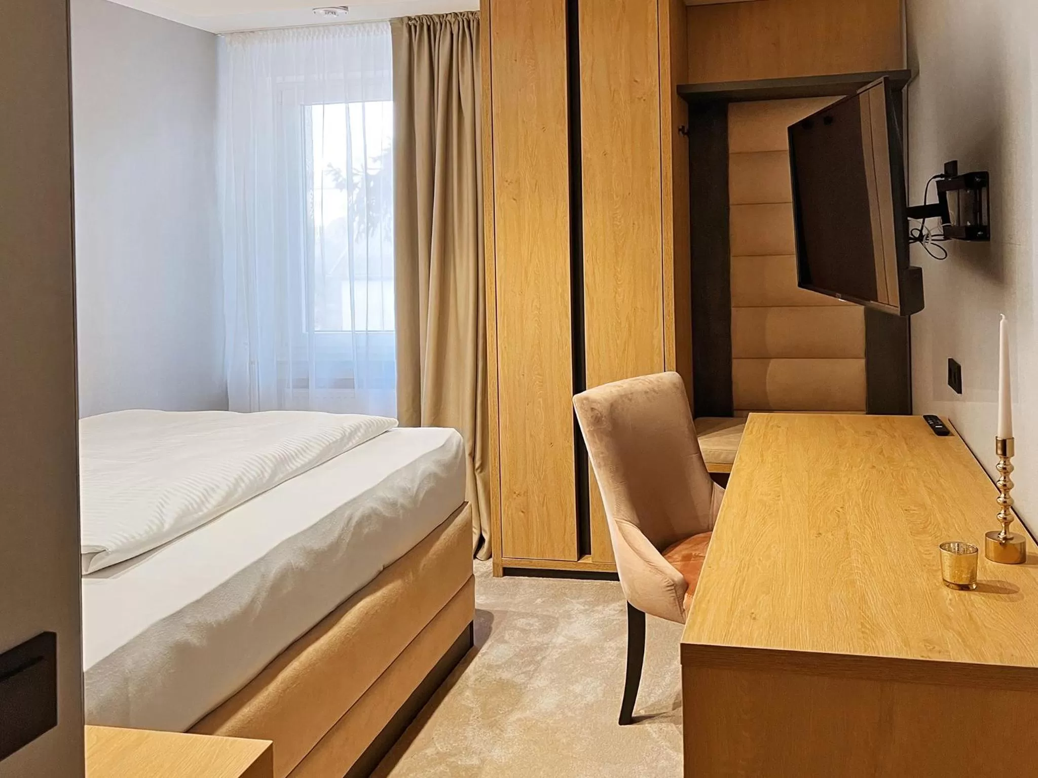 Photo of the whole room, Bed in DORMERO Hotel Reutlingen