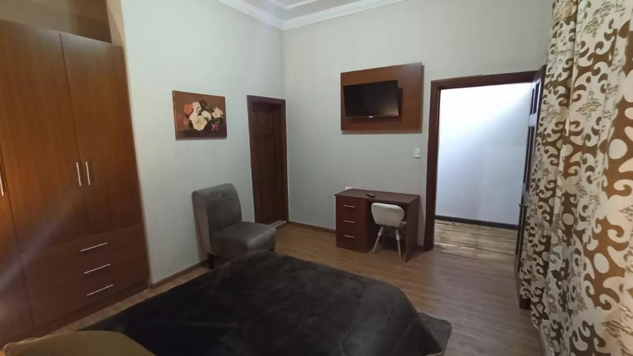 Bedroom, TV/Entertainment Center in Casa San Benito Hospedaje