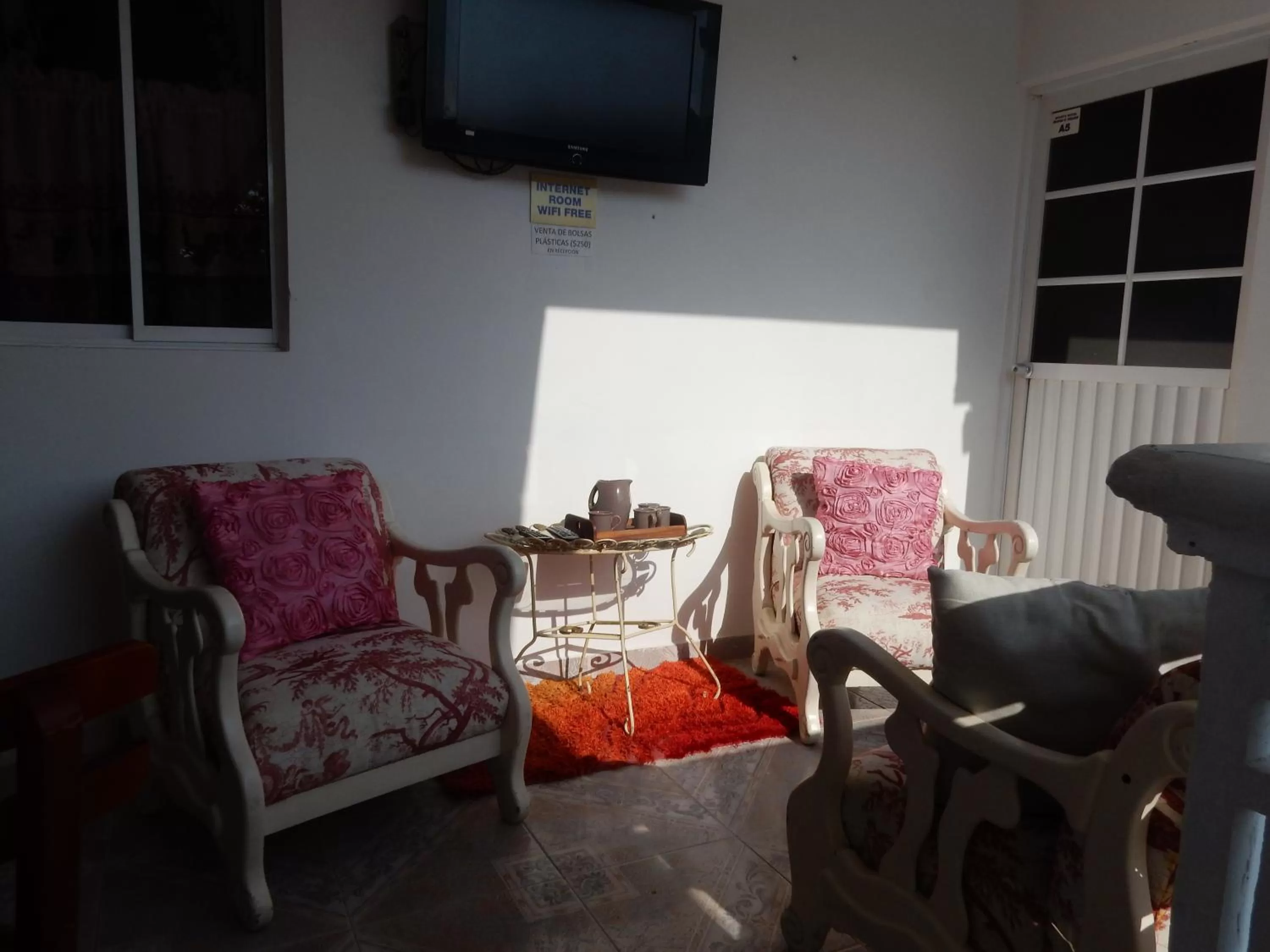 Communal lounge/ TV room, Seating Area in Maria's House - Boutique Hotel