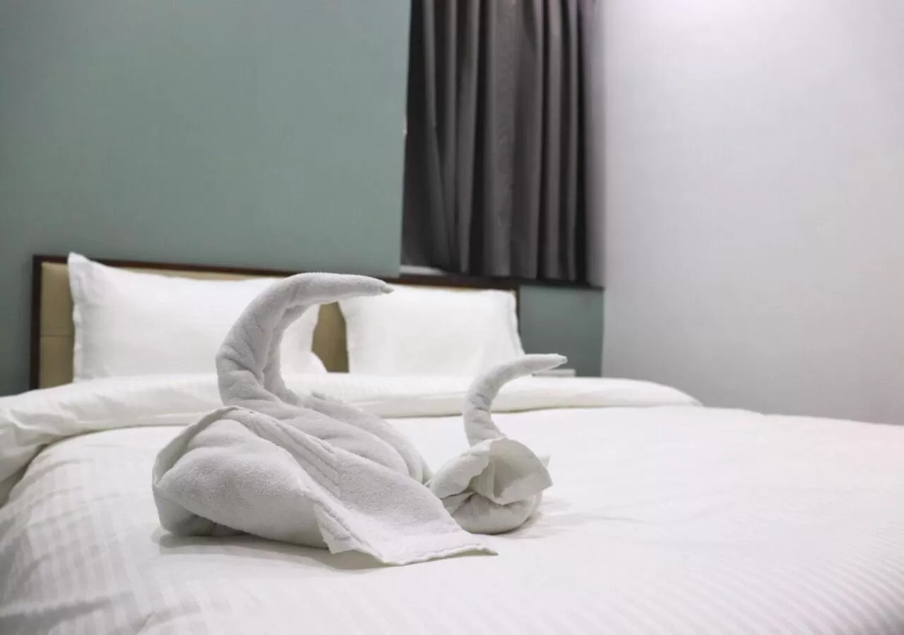 Bed in Sharman Suites