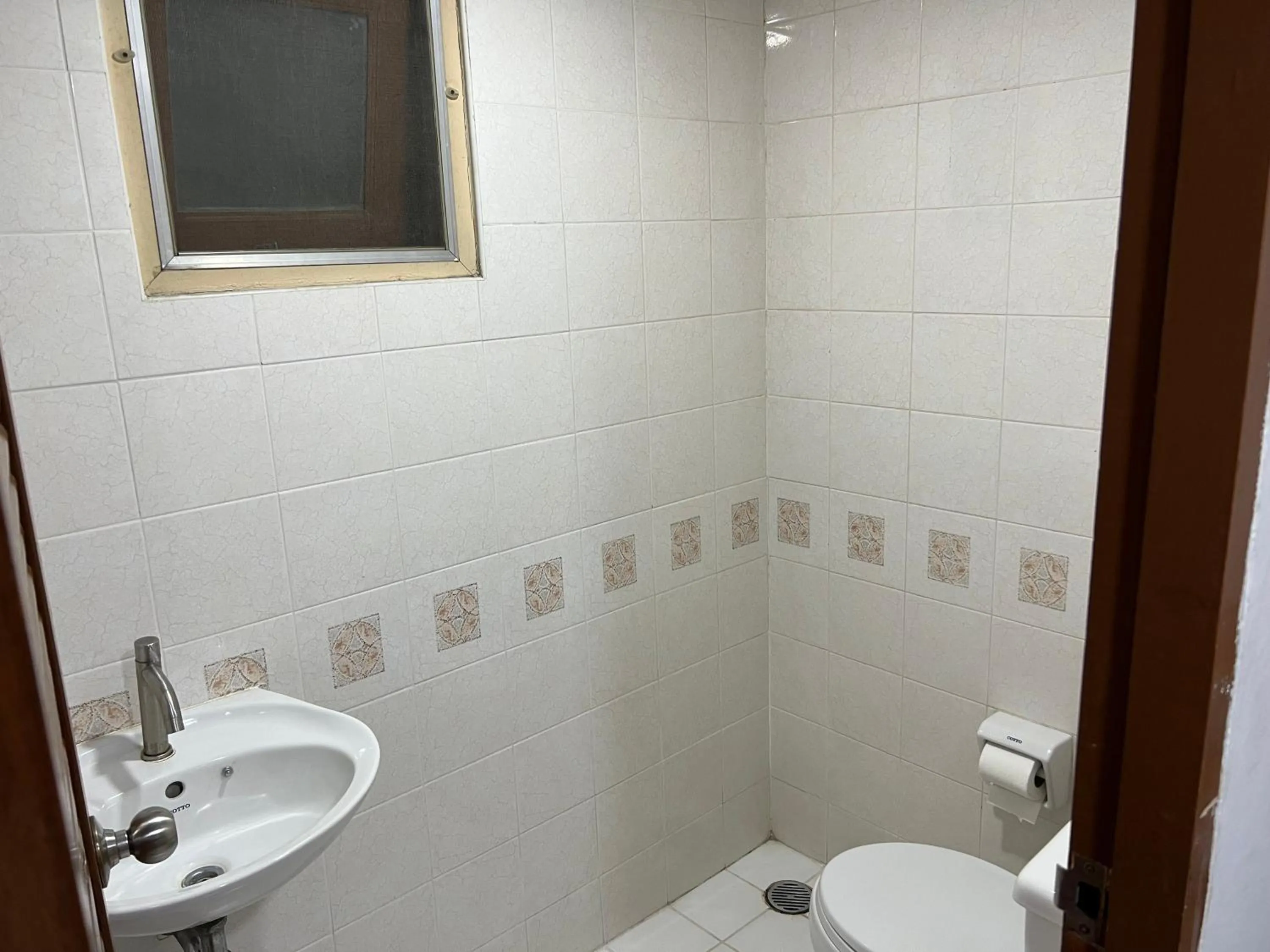 Toilet in Mall Suites Hotel