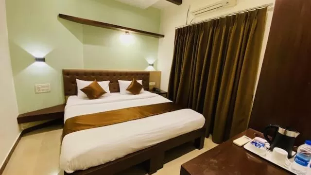 Bed in Hotel Plaza Heights by RAK Rooms, Mangaluru