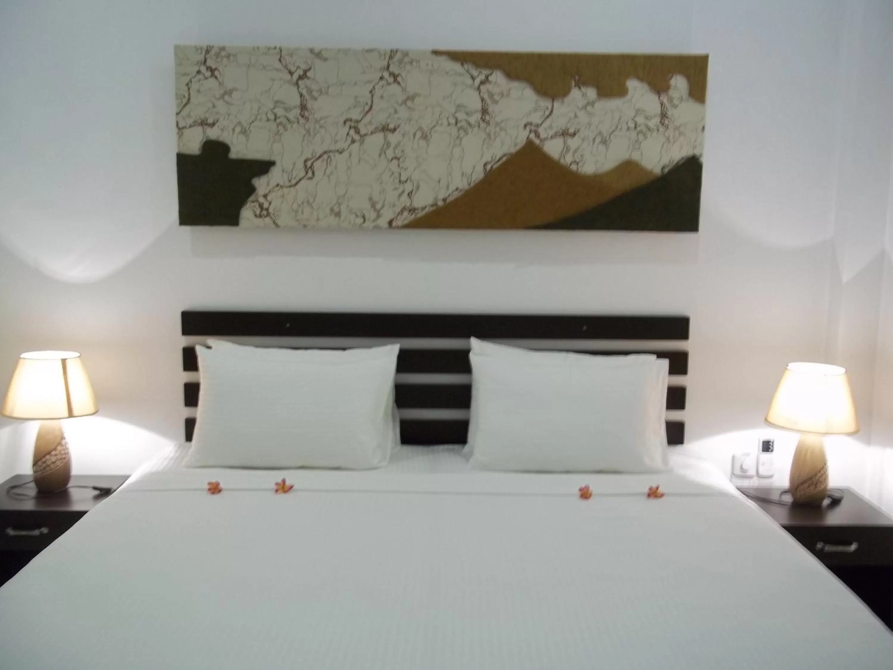 Bed in Sunrise Palace Negombo