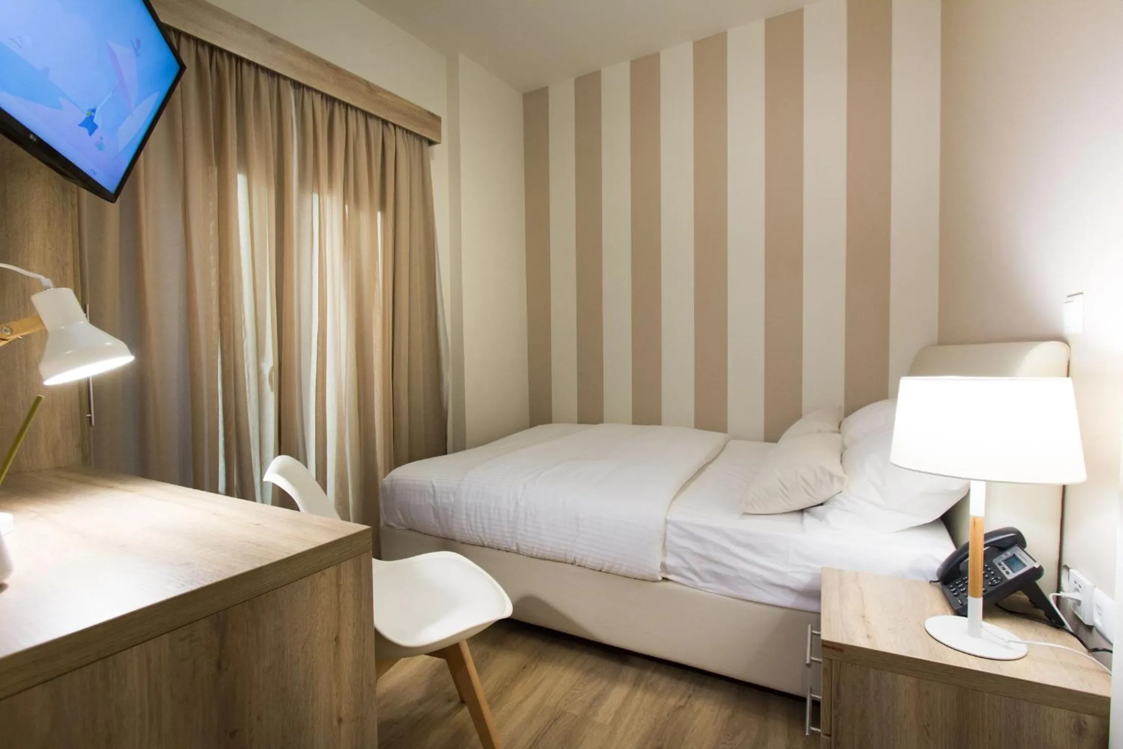 Photo of the whole room, Bed in Hotel @Syngrou Fix