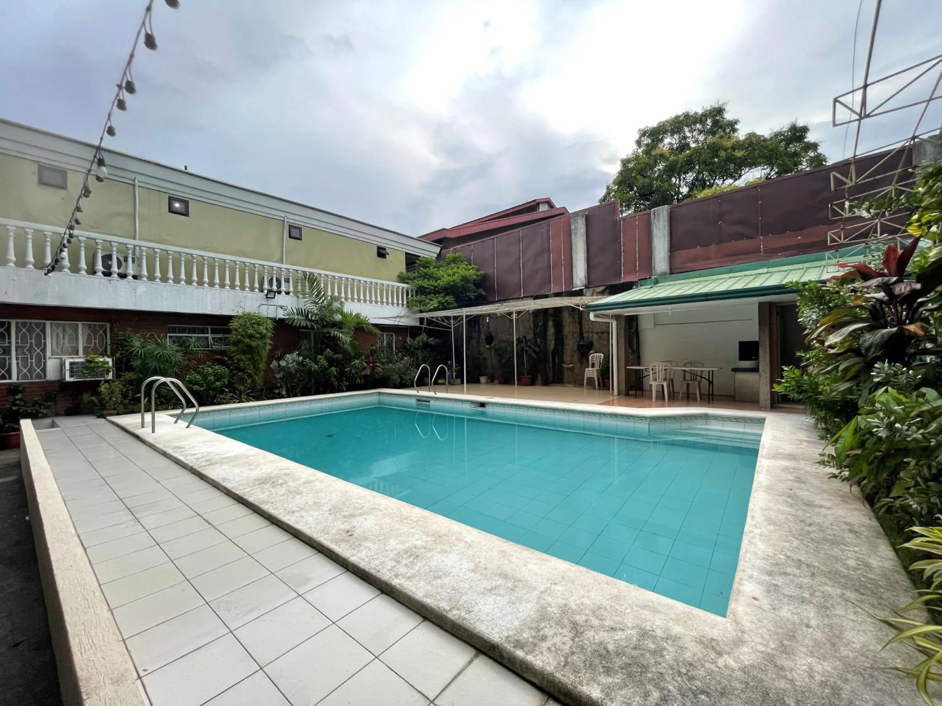 Swimming pool in 1888 Staycation Inn by Cocotel