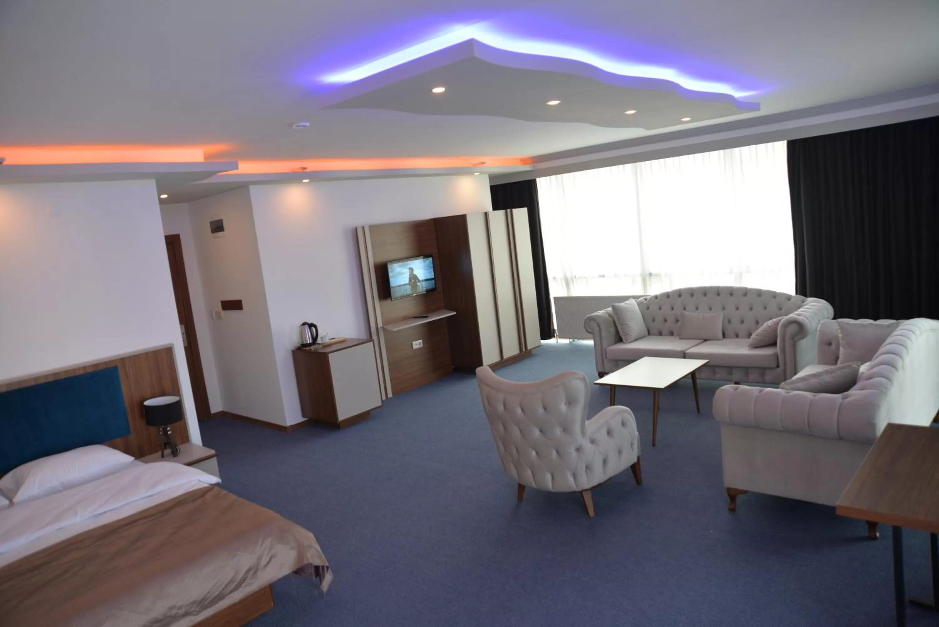 Bed in TEVETOGLU HOTEL