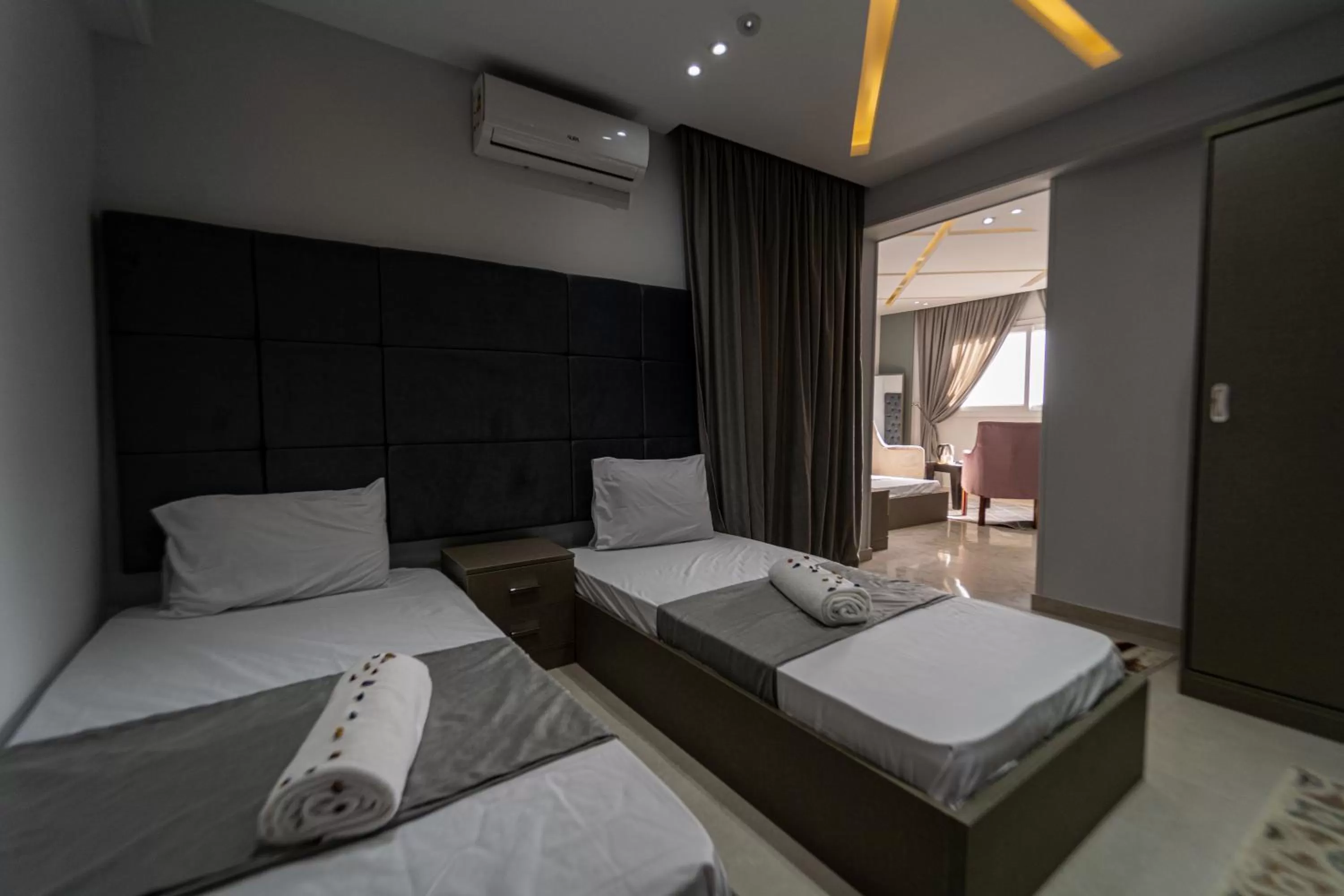 air conditioner, Bed in Gardenia Inn Hotel