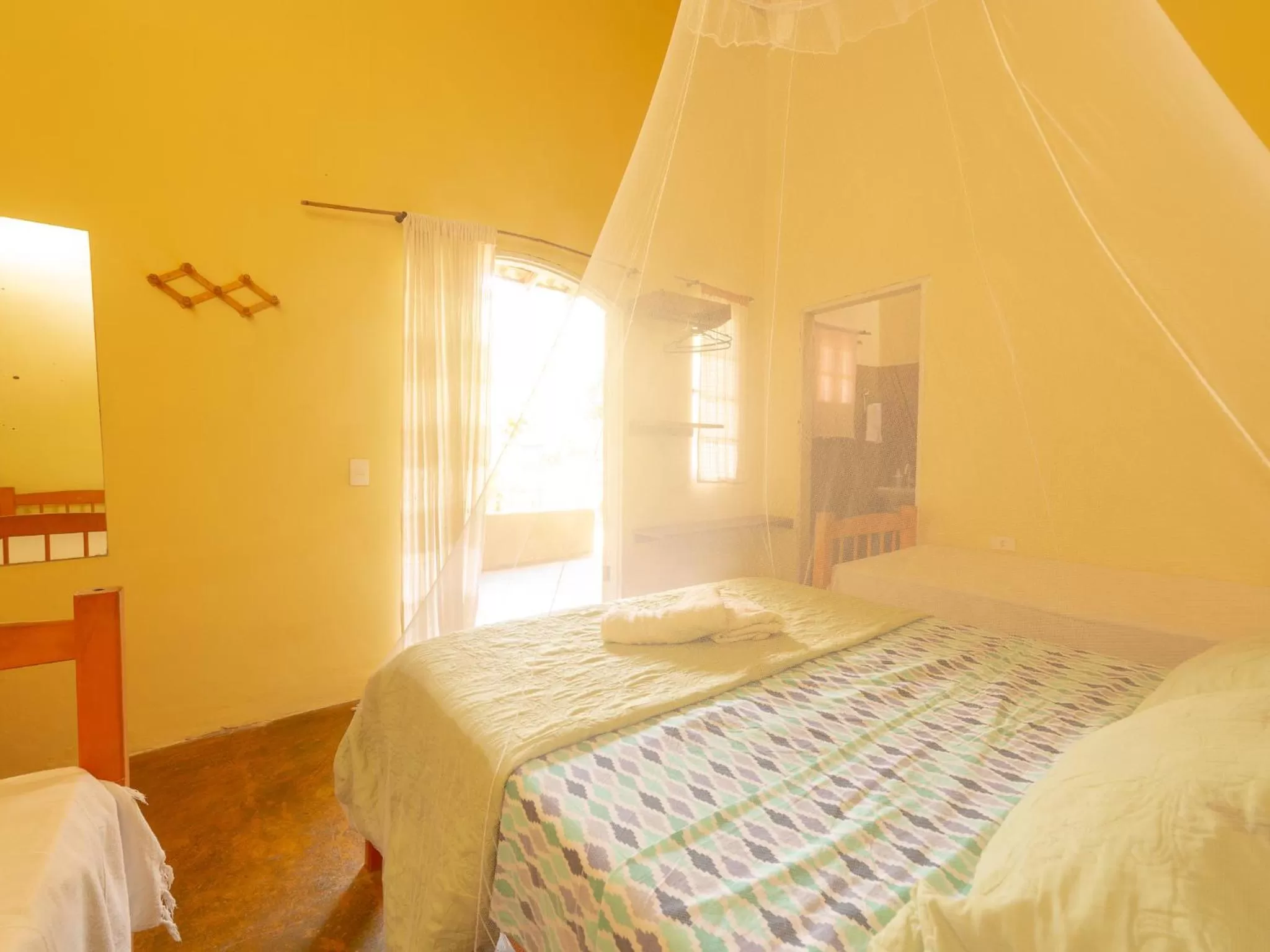 Photo of the whole room, Bed in Pousada da Rosa