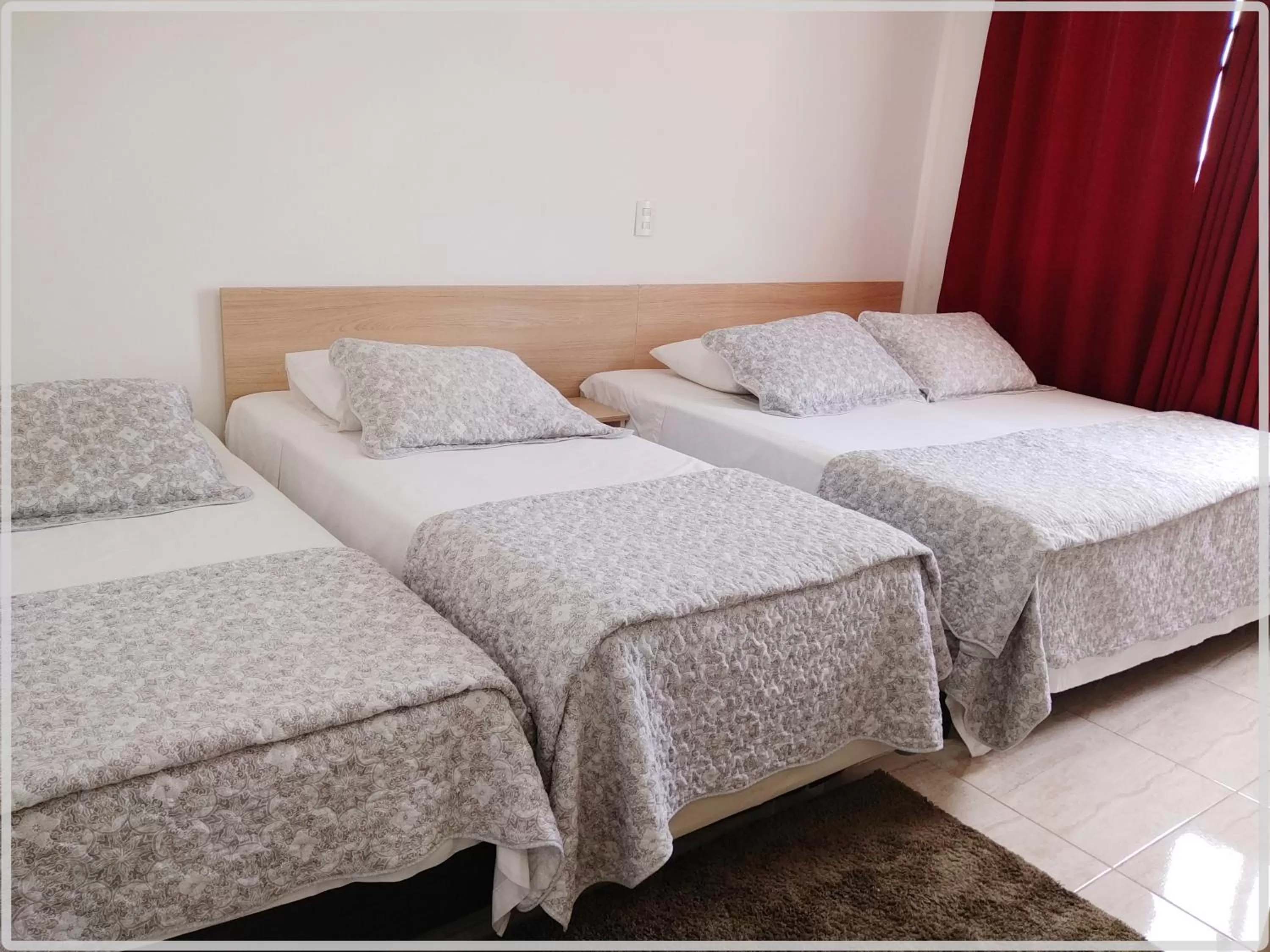 Bed in Hotel Anjos LTDA