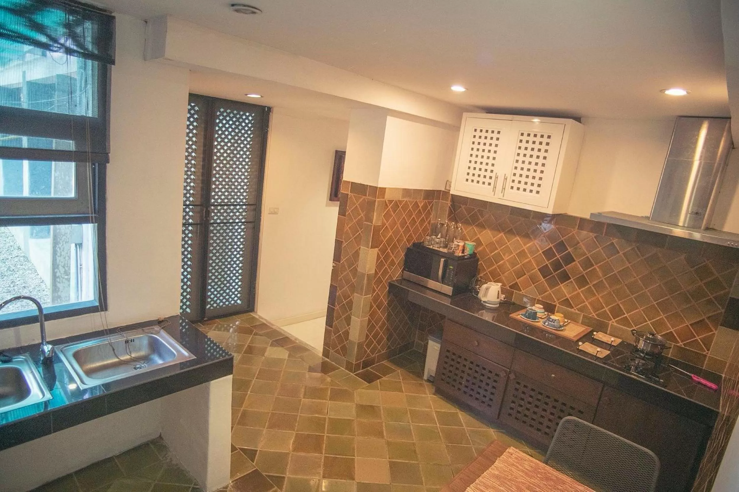 Kitchen or kitchenette in Baan Suan Residence เฮือนพักบ้านสวน
