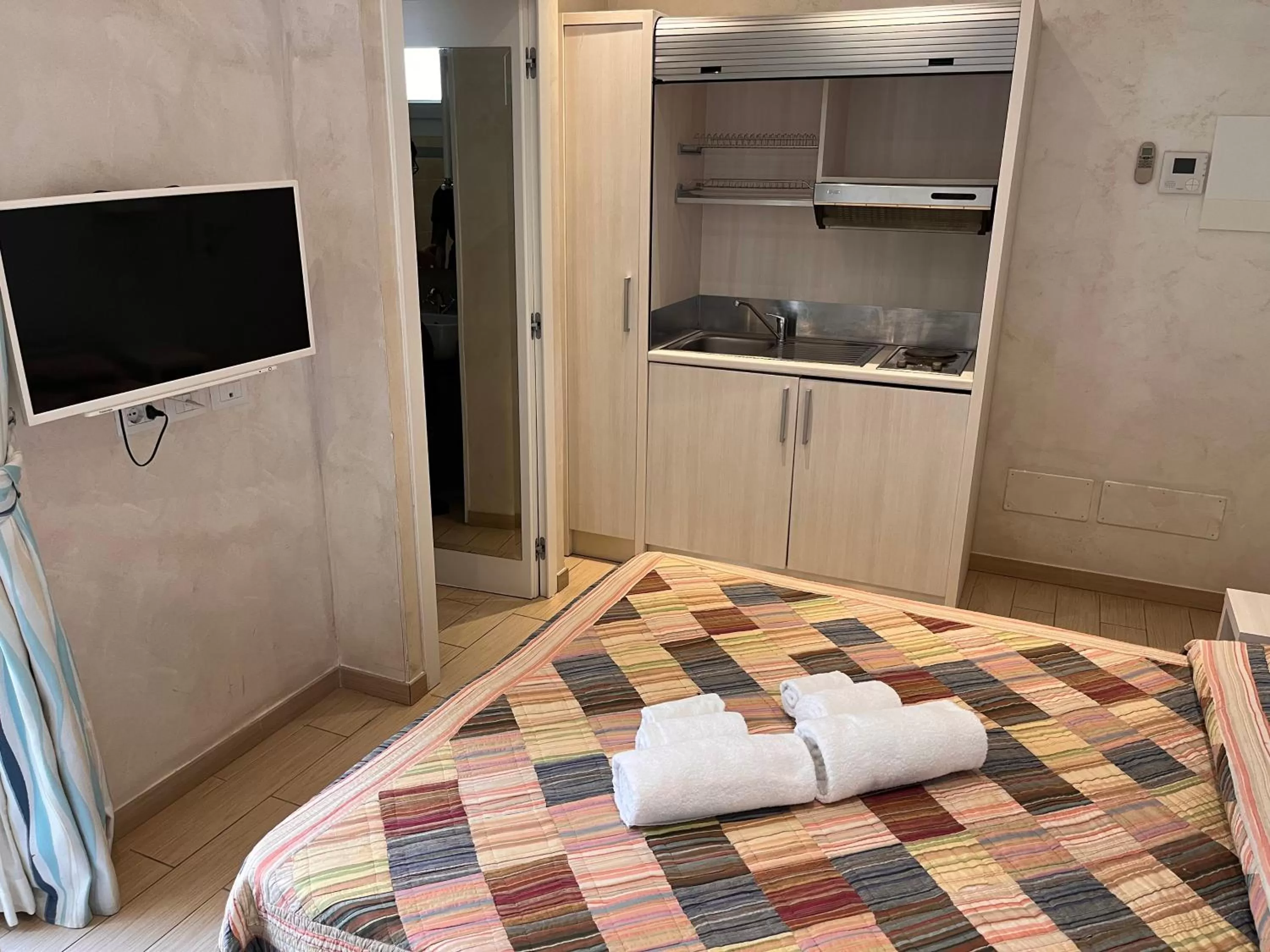 Photo of the whole room, TV/Entertainment Center in Marina Beach Suite Hotel